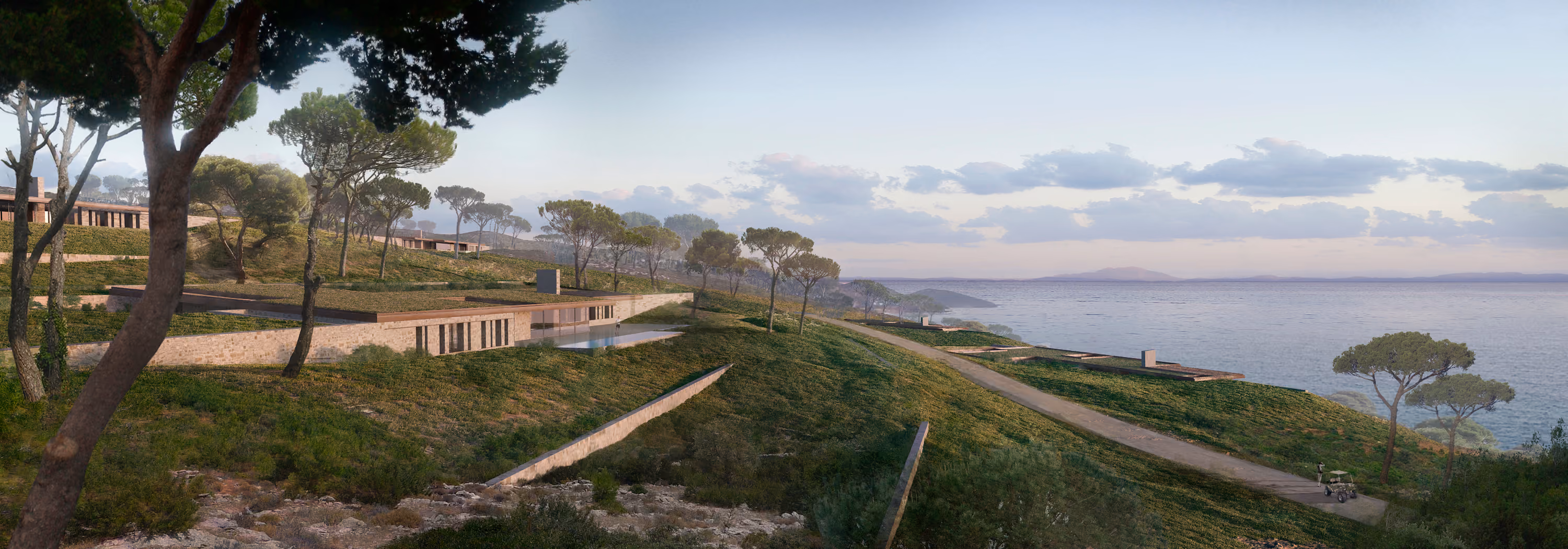 Low-lying stone villas of the Almost Invisible Resort in Bodrum set into a pine-covered hillside overlooking the Mediterranean coastline