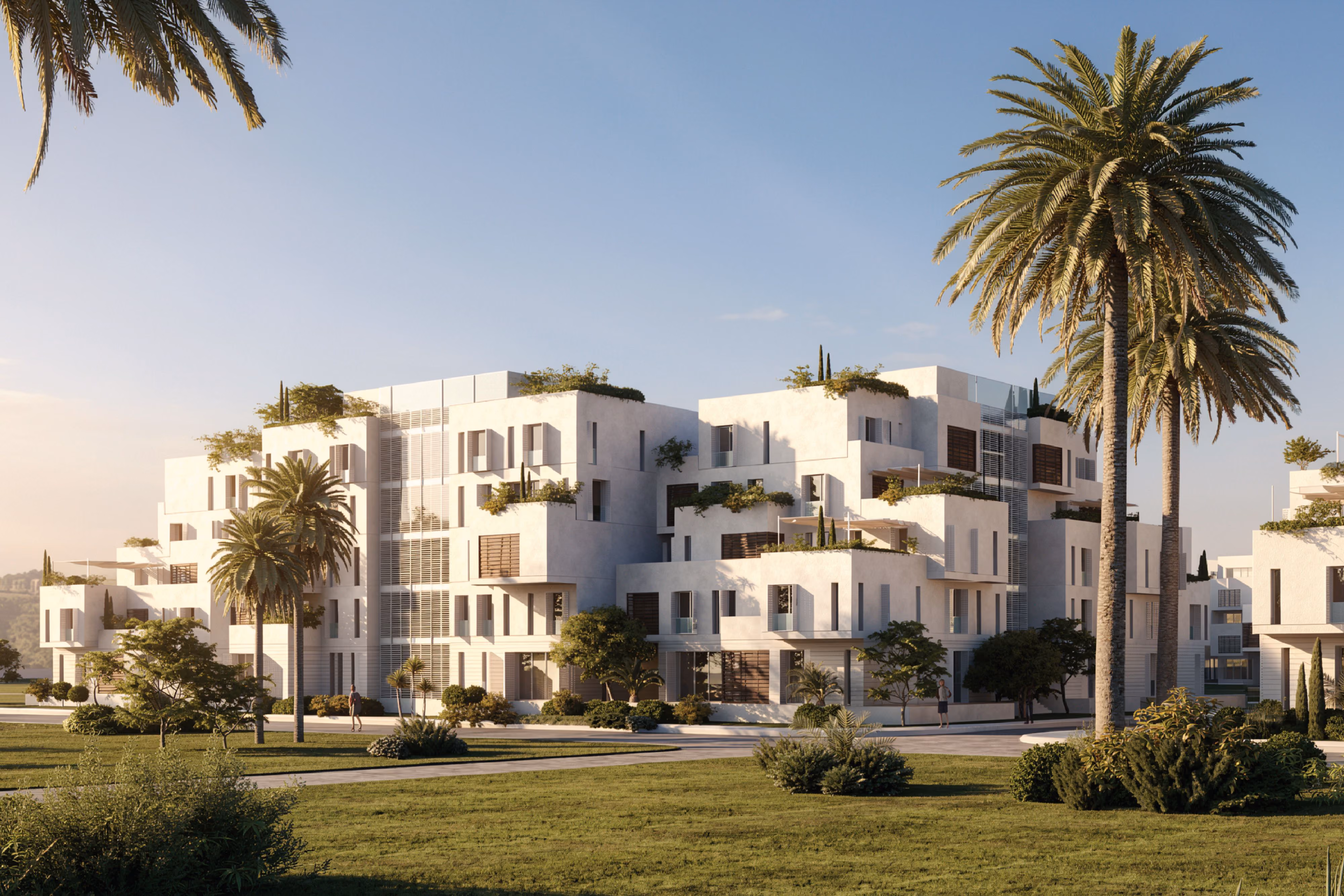Esplanade Eastown, stepped white residential blocks with terraced greenery by Nabil Gholam Architects, set among palm trees and lawns in Cairo, Egypt