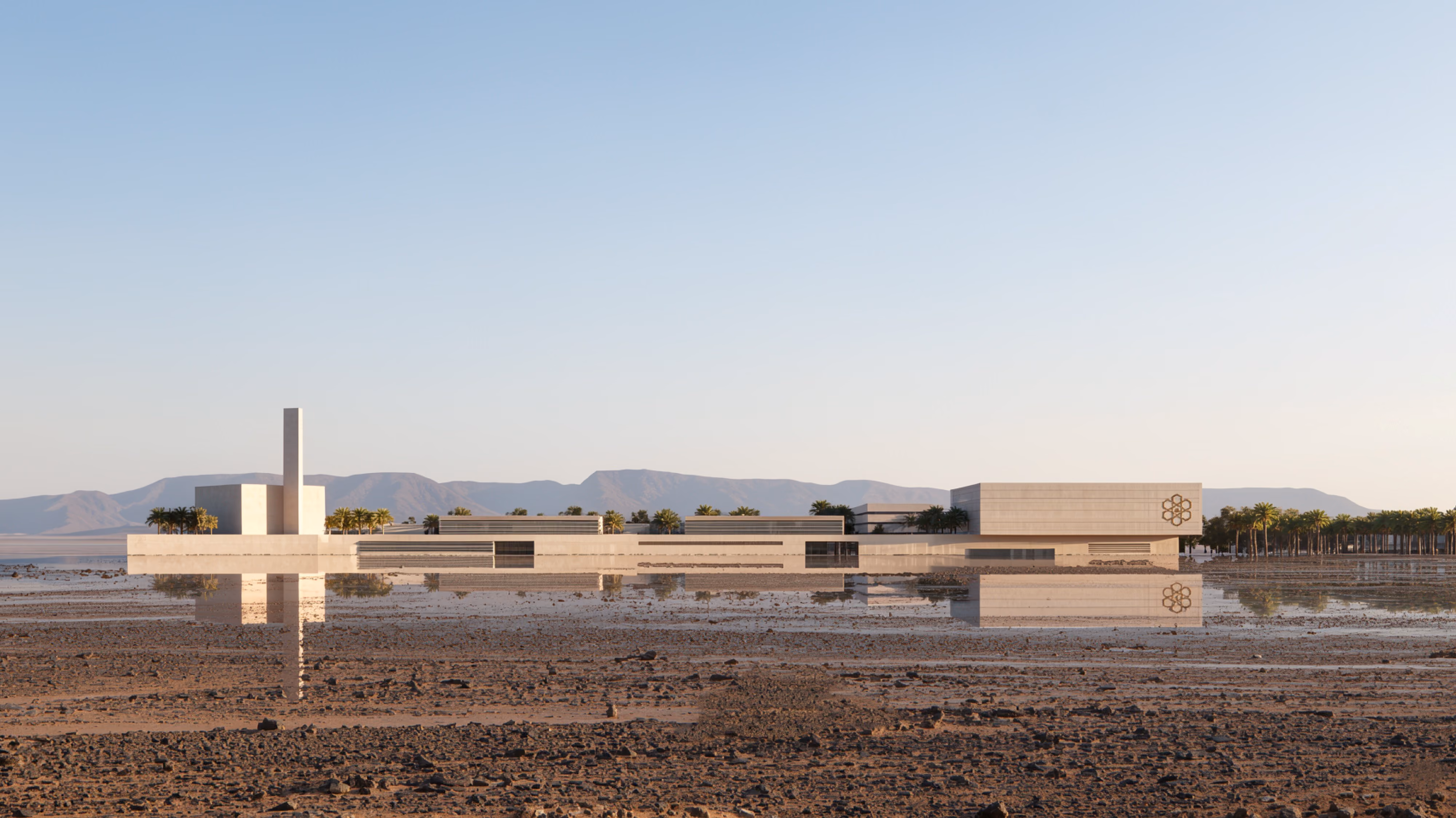 Industrial Campus by Nabil Gholam Architects, low-slung stone buildings with a slender tower reflected in shallow water amid the desert of Ain El Sokhna, Egypt