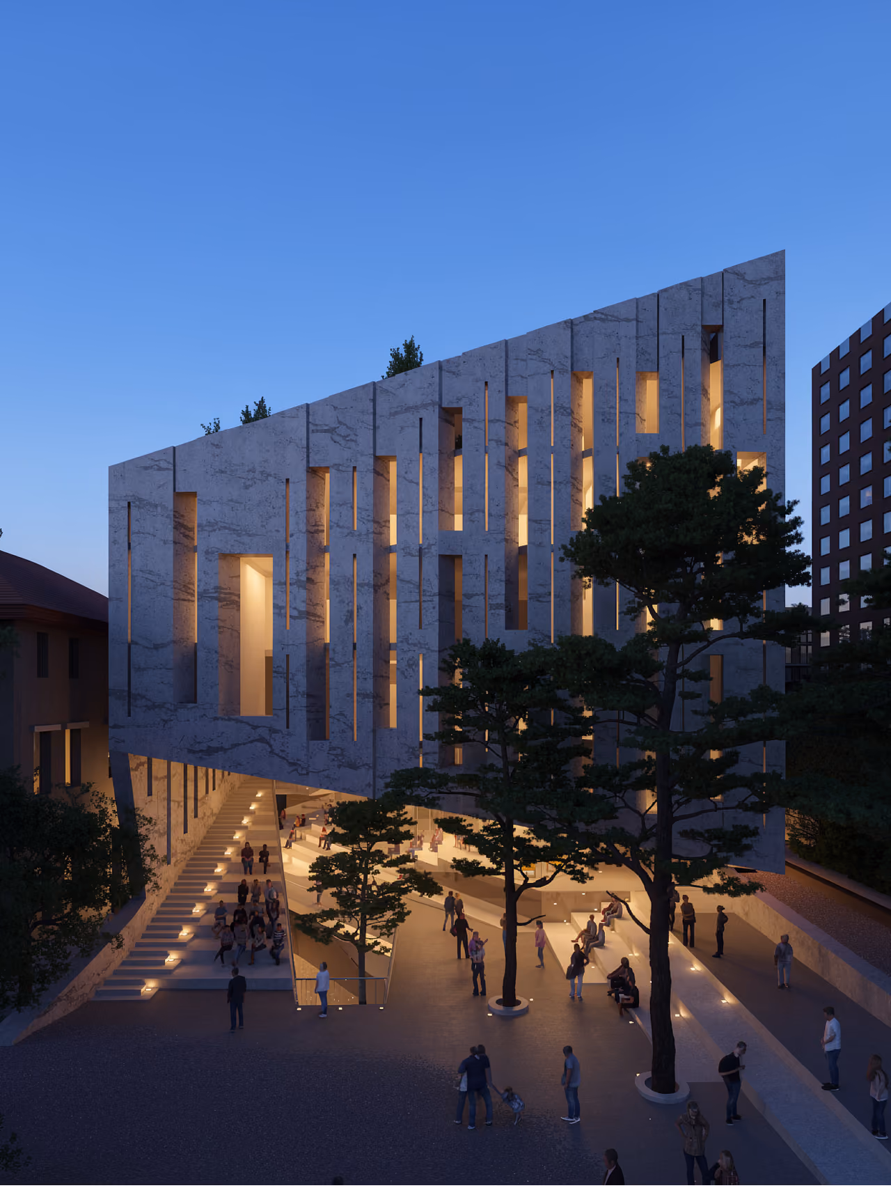 Evening view of the AUB Faculty of Arts and Science in Beirut, cantilevered stone facade with vertical light slits above a terraced public stair filled with people