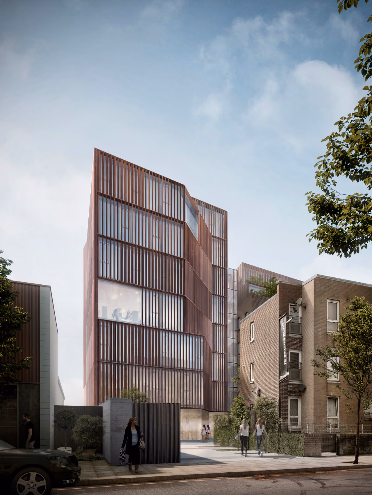 78-89 Lots Road in Chelsea, London, a mid-rise building with vertical bronze-toned fins beside brick residential terraces, seen from street level with pedestrians