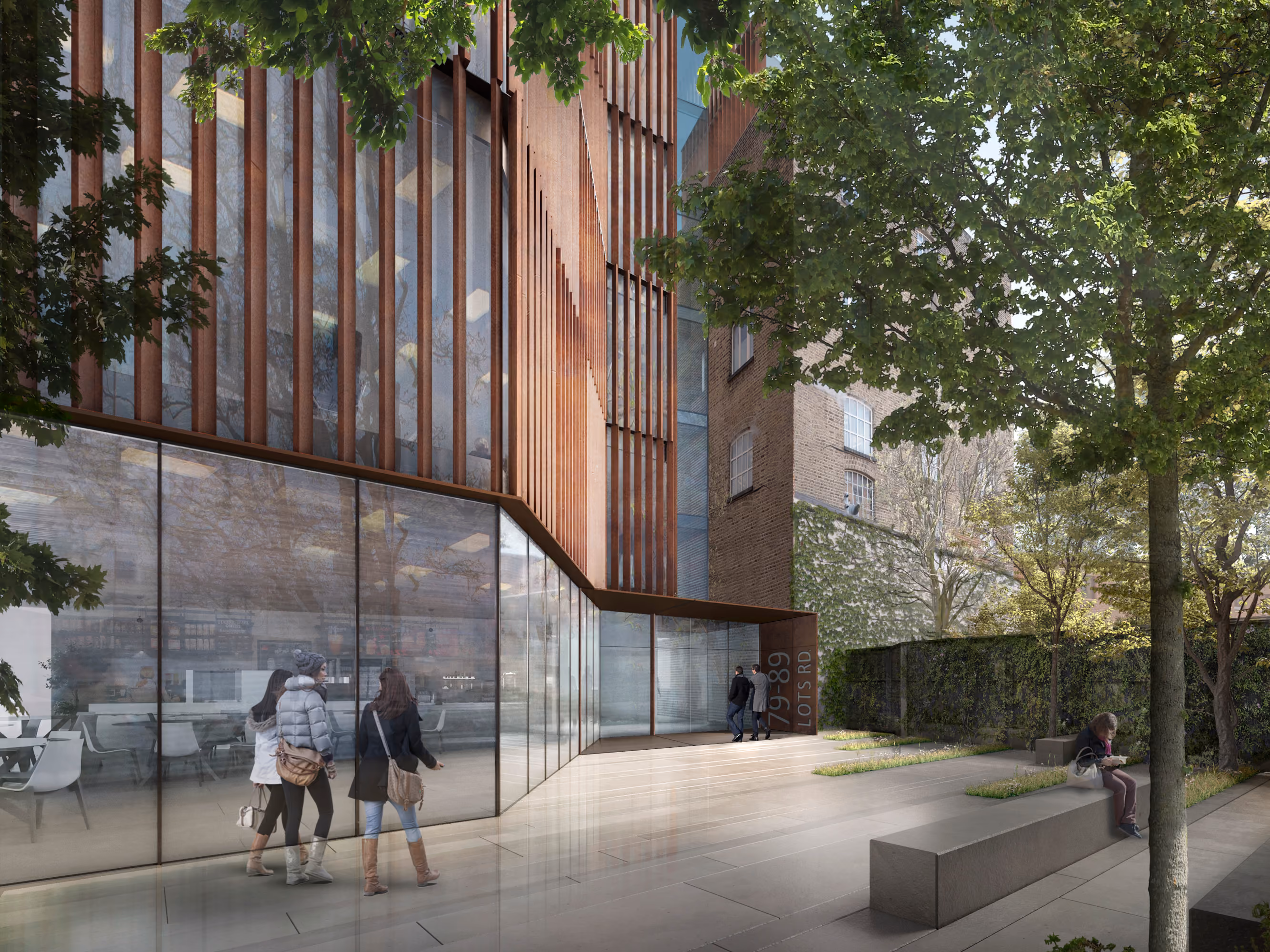 Street-level view of 78-89 Lots Road in Chelsea, London, showing corten-clad vertical fins above a glazed ground floor with pedestrians and a landscaped forecourt
