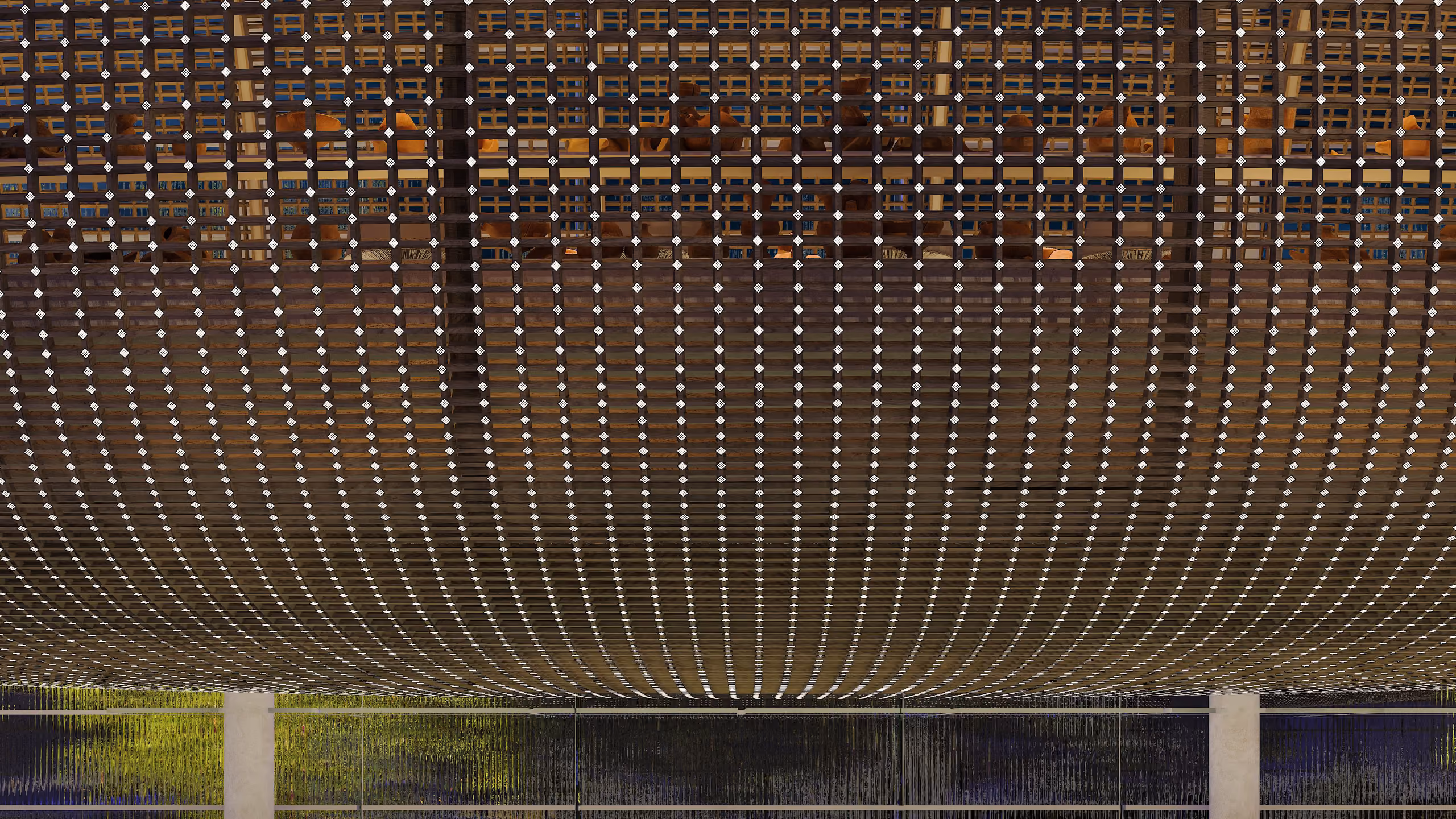 Curved woven metal pod ceiling of Art Hub in Beirut, a grid of diamond studs catching light above glazed openings at ground level