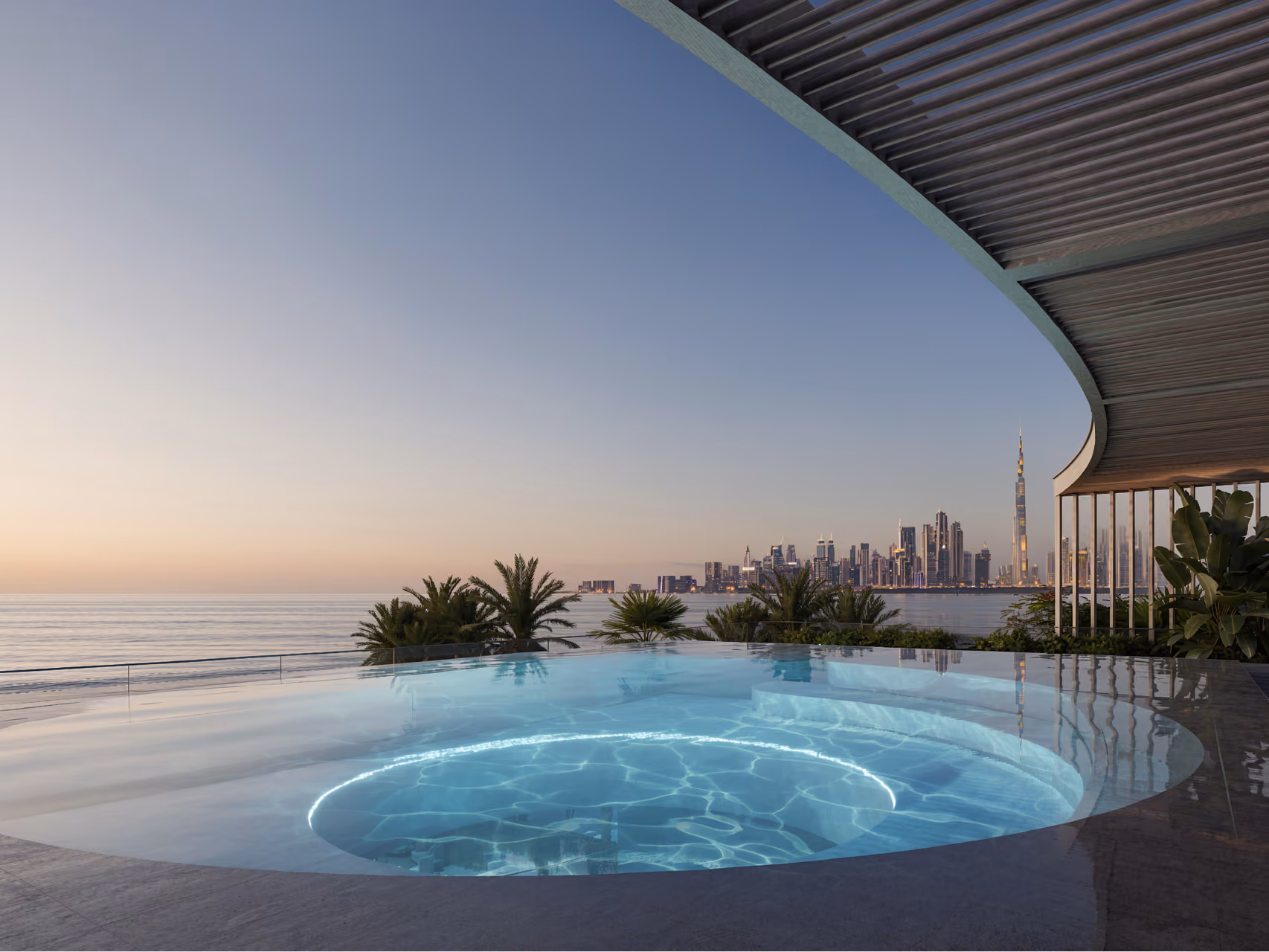 Curved infinity pool at MV 33 in Dubai, sheltered by a slatted overhang, with palm trees and the city skyline including Burj Khalifa at dusk