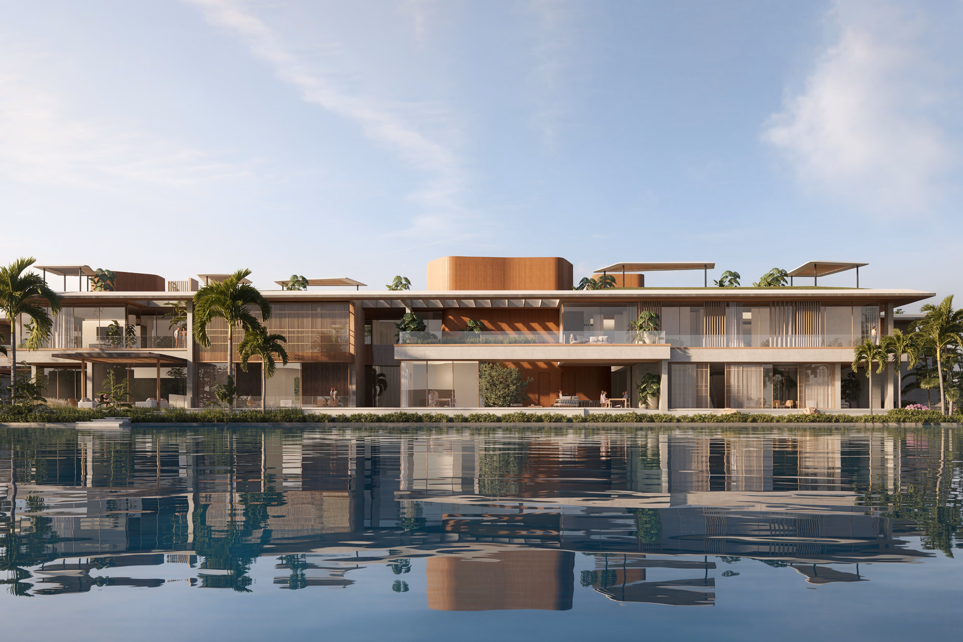 Lagoon Mansion in Dubai, a low-rise waterfront residence with timber and glass volumes, shaded terraces and palm trees, reflected in the lagoon