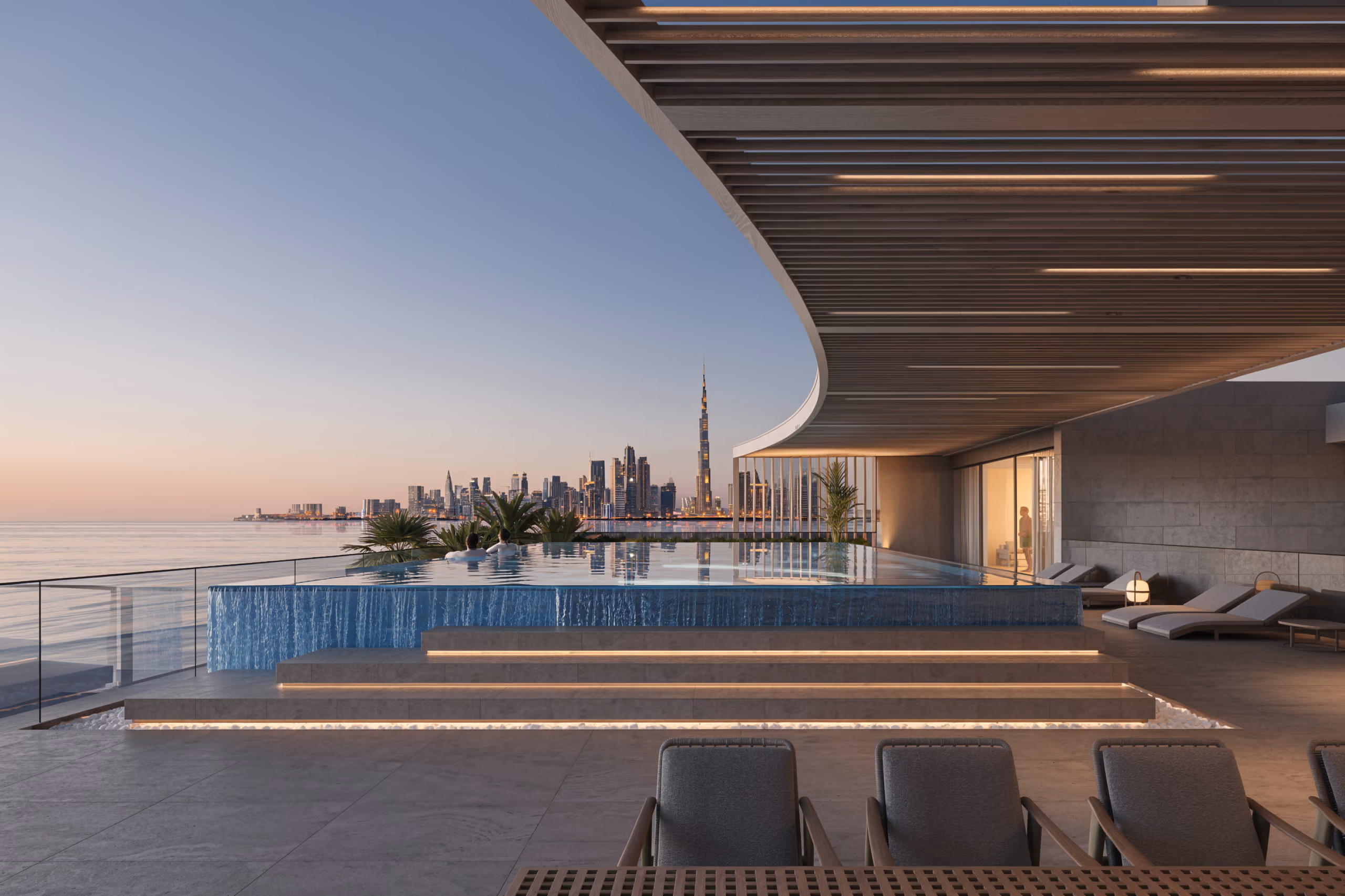 Rooftop infinity pool at MV 33 in Dubai, curved wooden canopy framing a sunset view of the city skyline and sea beyond loungers