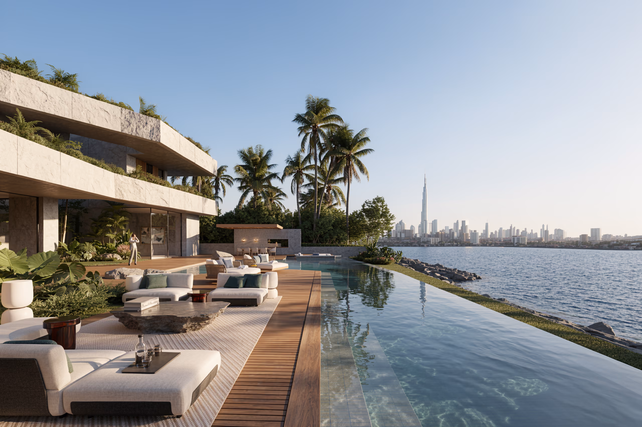Waterfront terrace and infinity pool at Geode villa in Dubai, with loungers, palm trees and the city skyline across the water