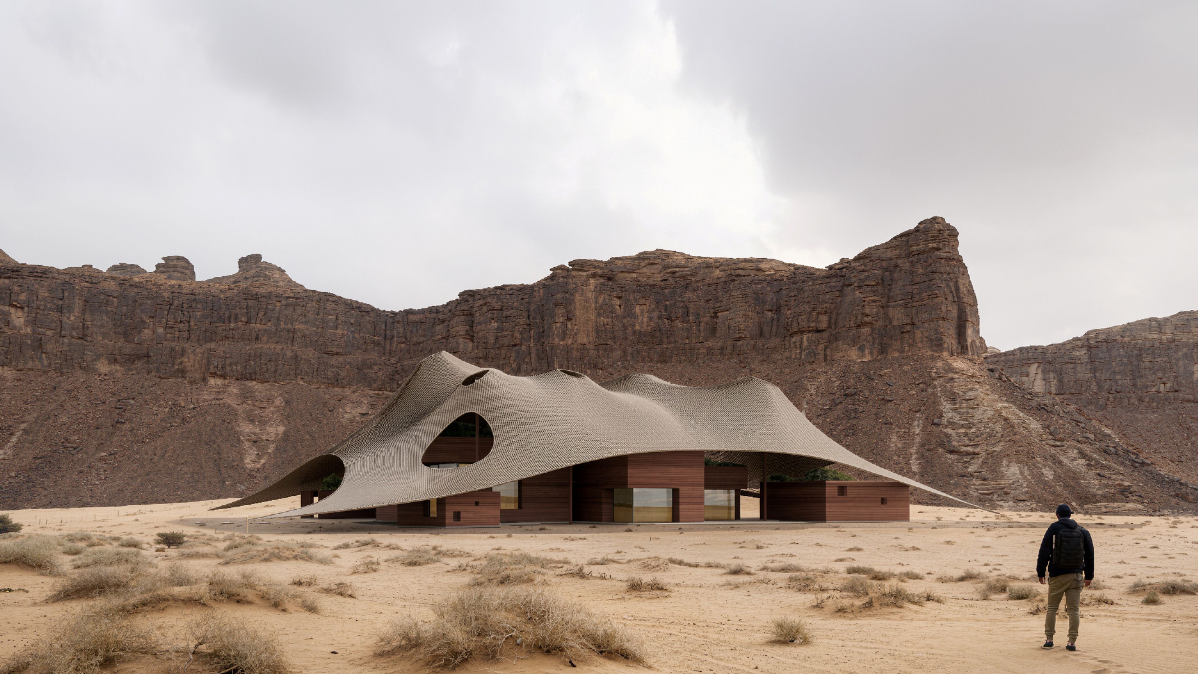 Buyut, a residential project by Nabil Gholam Architects with a wave-like perforated canopy over timber-clad volumes, set among sandstone cliffs in Al Ula, Saudi Arabia