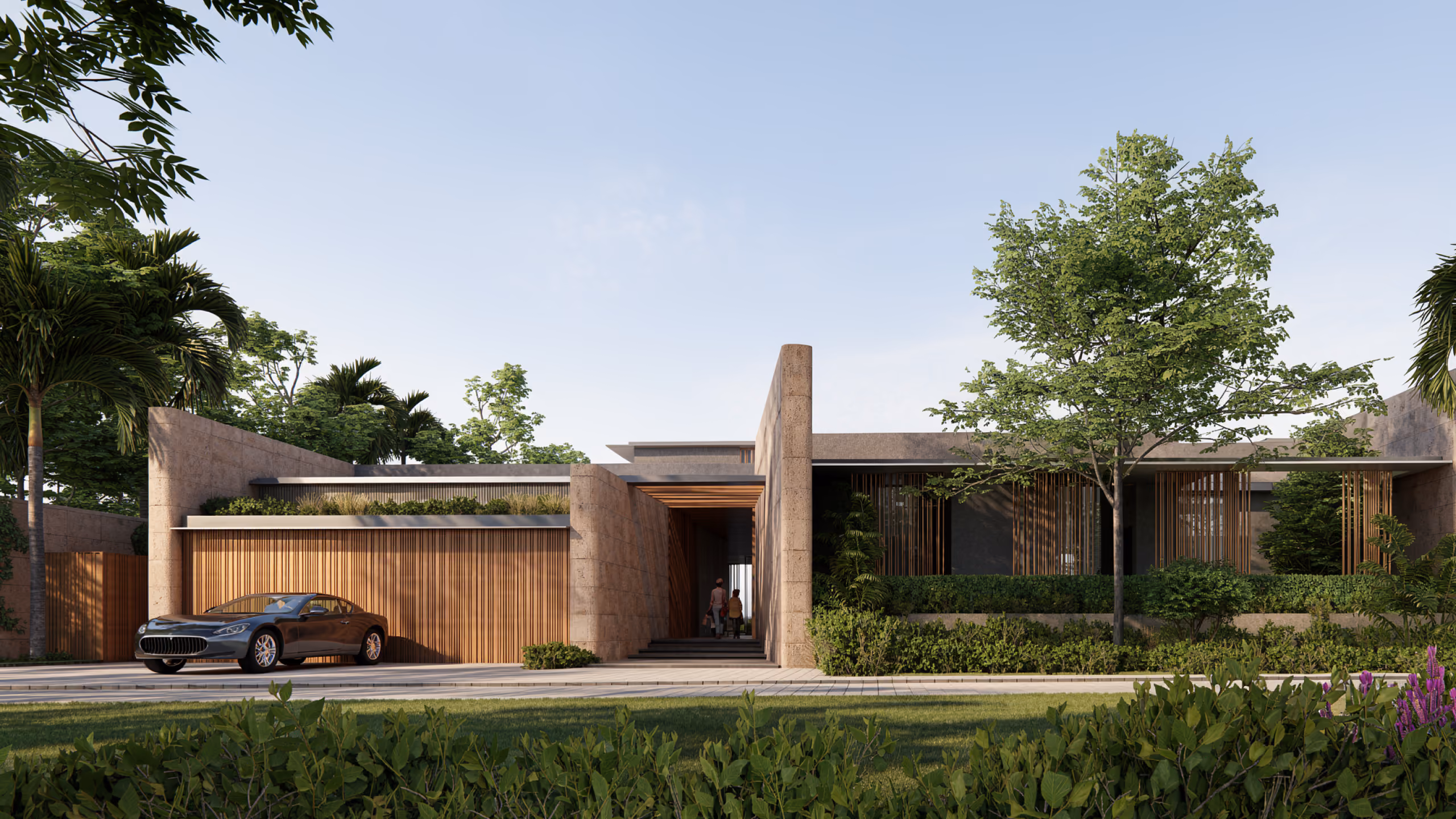 Entrance facade of a Beach Club Villa in Dubai, stone walls with timber slat screens, a car in the driveway and lush landscaping under a clear sky