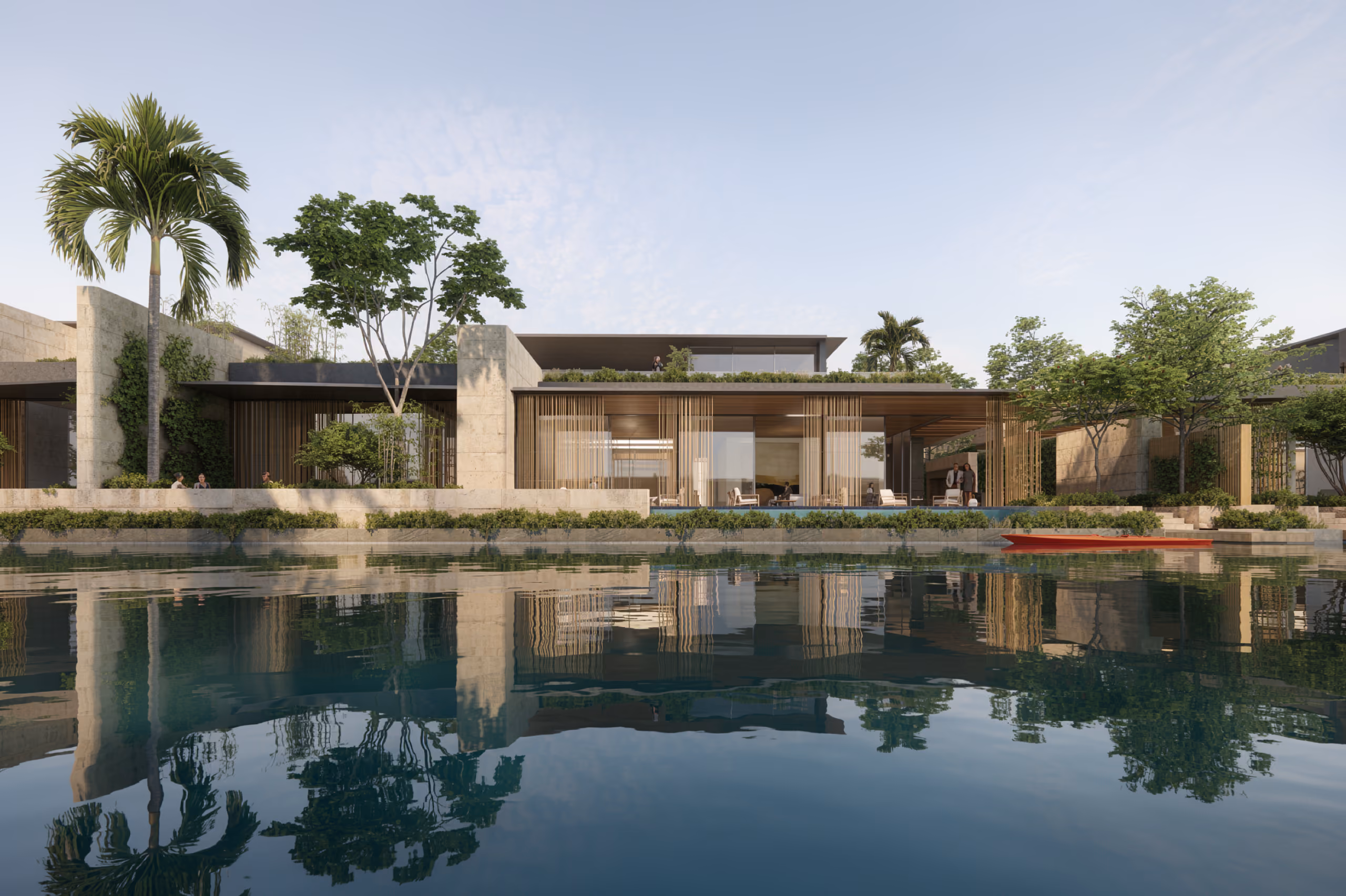 Stone-walled villa at Beach Club Villas in Dubai, timber screens and lush palms reflected in the calm lagoon water, red kayak moored at the edge