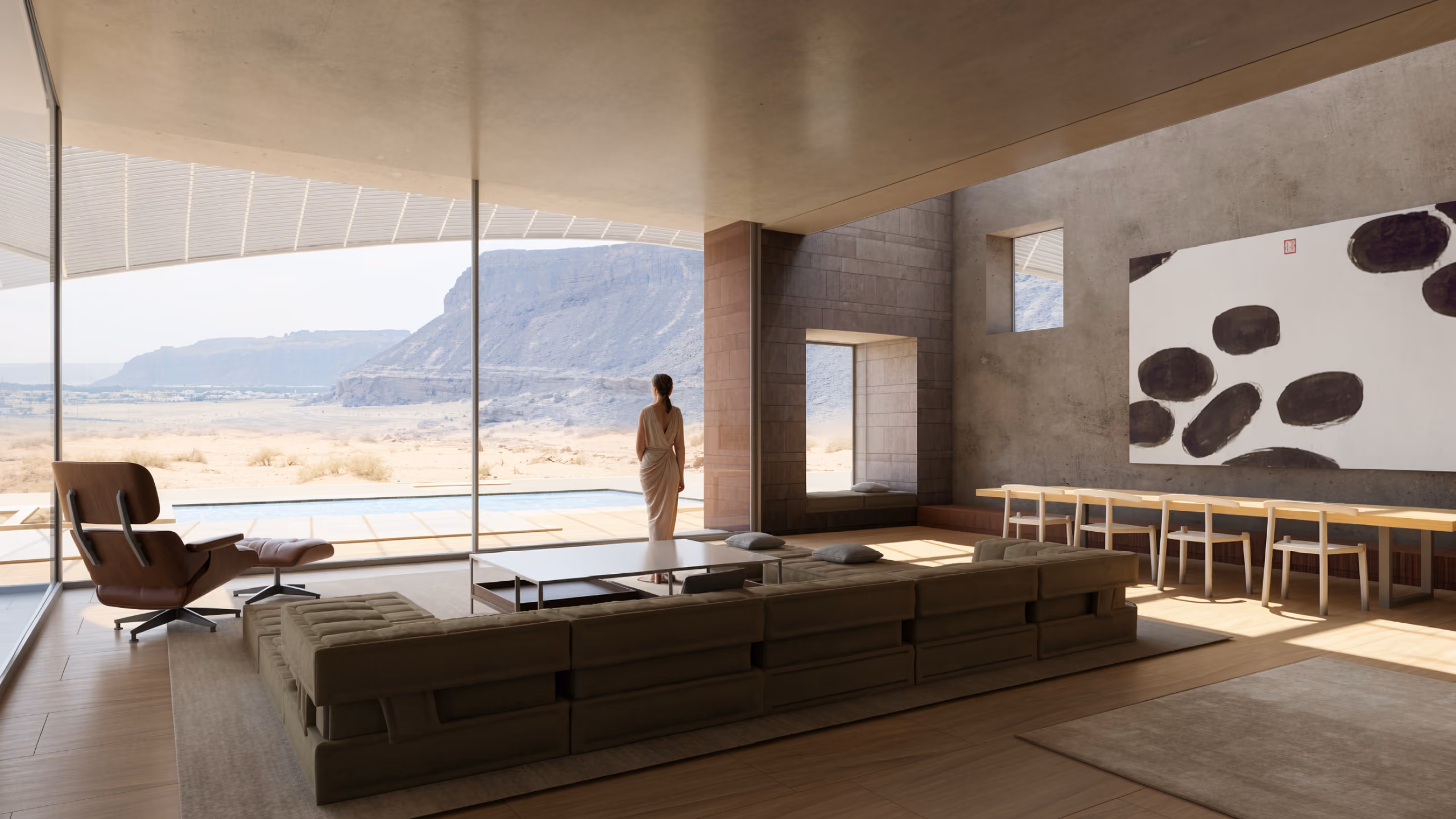 Living area of Buyut in Al Ula, sunken lounge and dining table facing a glazed wall overlooking a pool, palm trees and desert cliffs