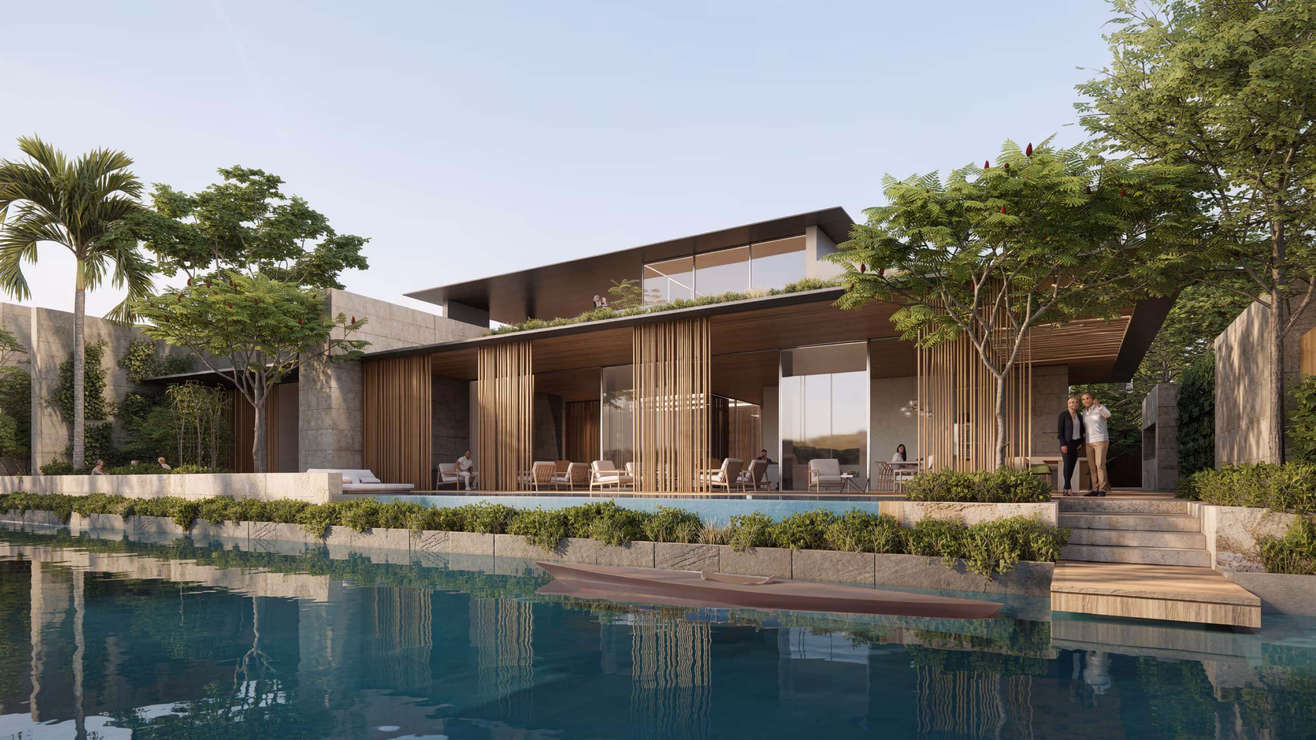 Timber-slatted living pavilion of a Beach Club Villa in Dubai opening onto a lagoon, with stone walls, landscaping and a canoe floating in the water