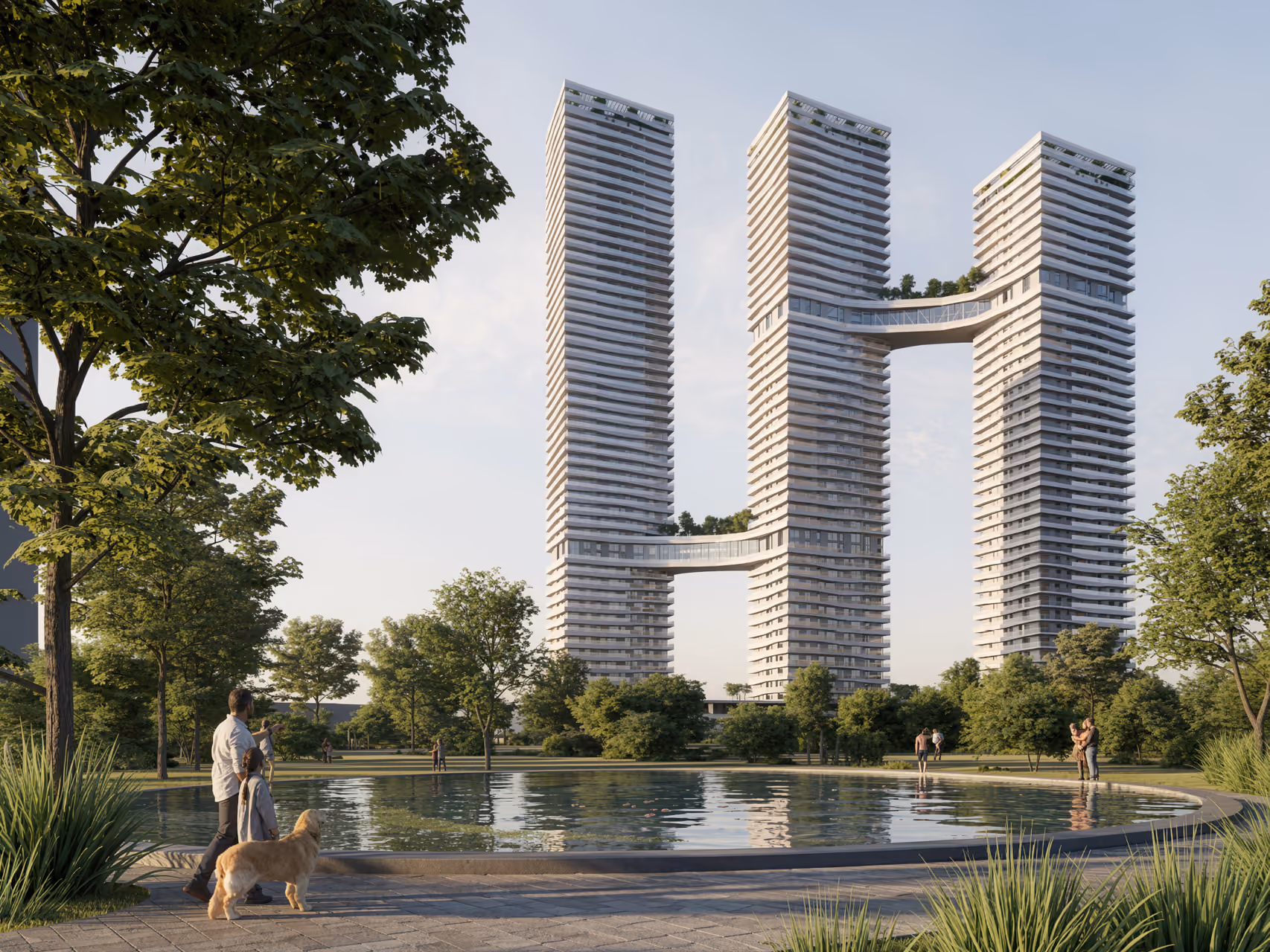 Trilliant in Dubai, three linked residential towers with sky-bridges, seen across a landscaped park with a reflecting pool and people strolling with a dog