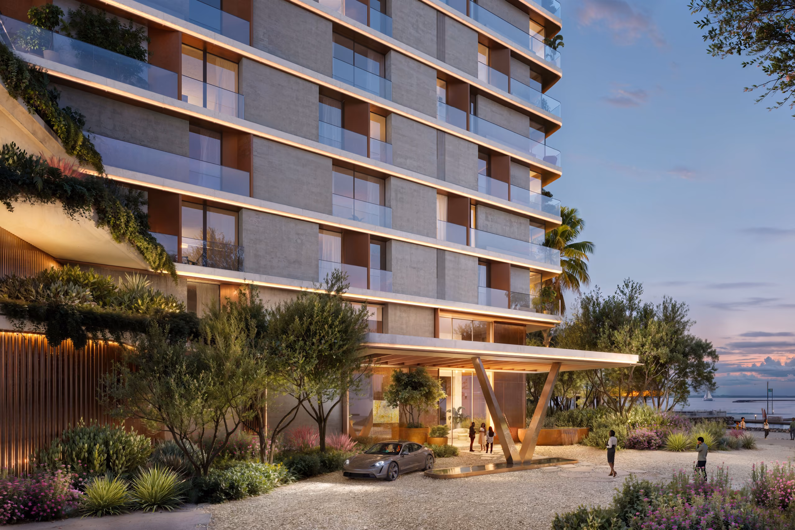 Entrance of Orise in Dubai at dusk, a cantilevered timber canopy over the lobby drive framed by lush landscaping and terraced balconies