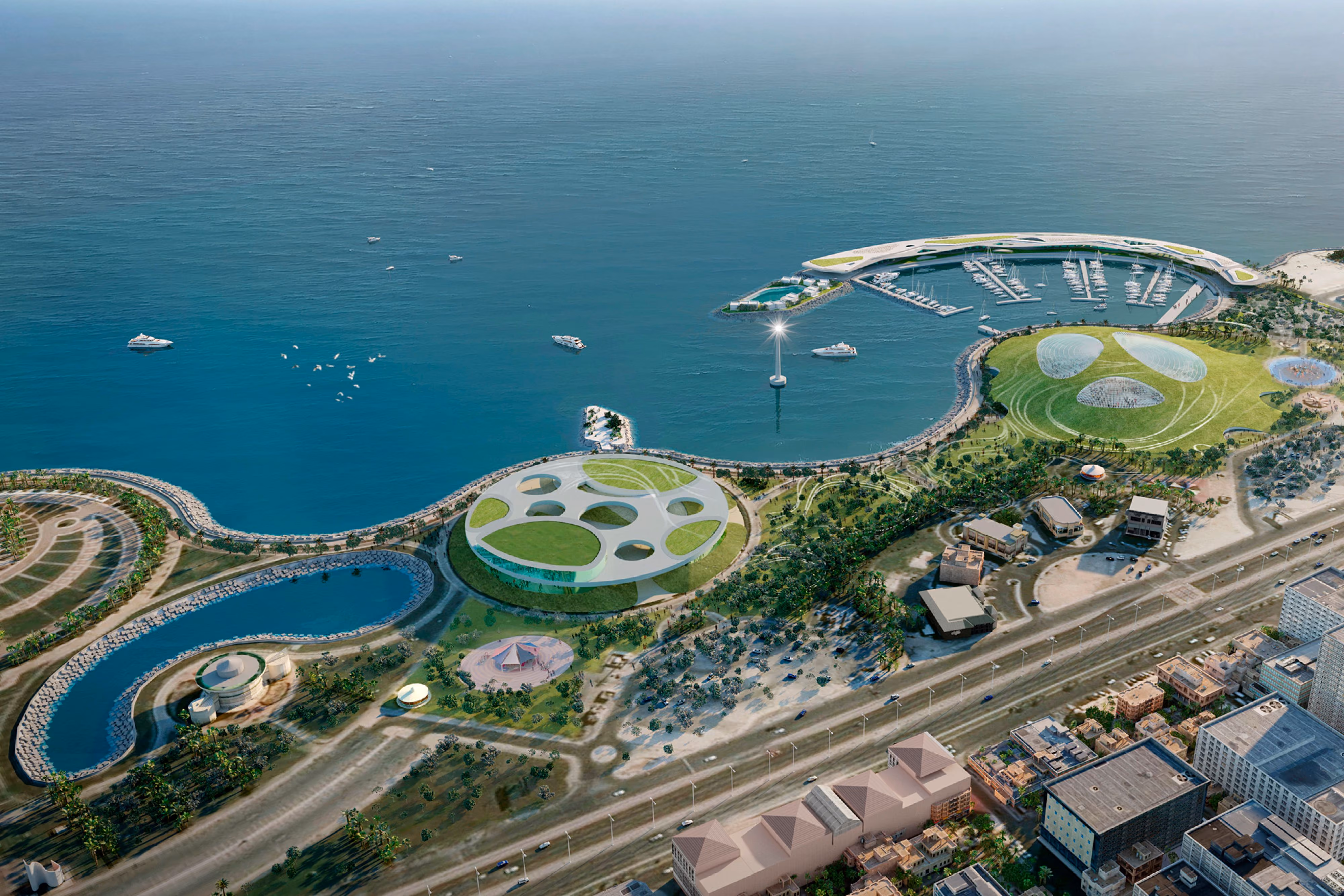 Aerial view of the Seafront Entertainment Center in Al Khobar, Saudi Arabia, by Nabil Gholam Architects, showing a circular perforated pavilion, marina and coastal promenade