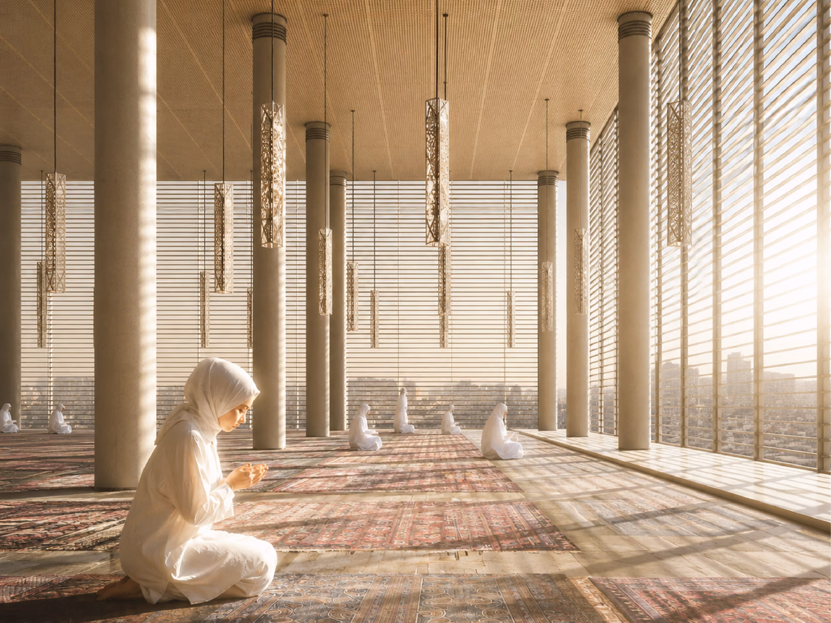 Prayer hall at Jabal Omar in Mecca, worshippers kneeling on patterned carpets beneath tall columns and hanging perforated light fixtures at sunset