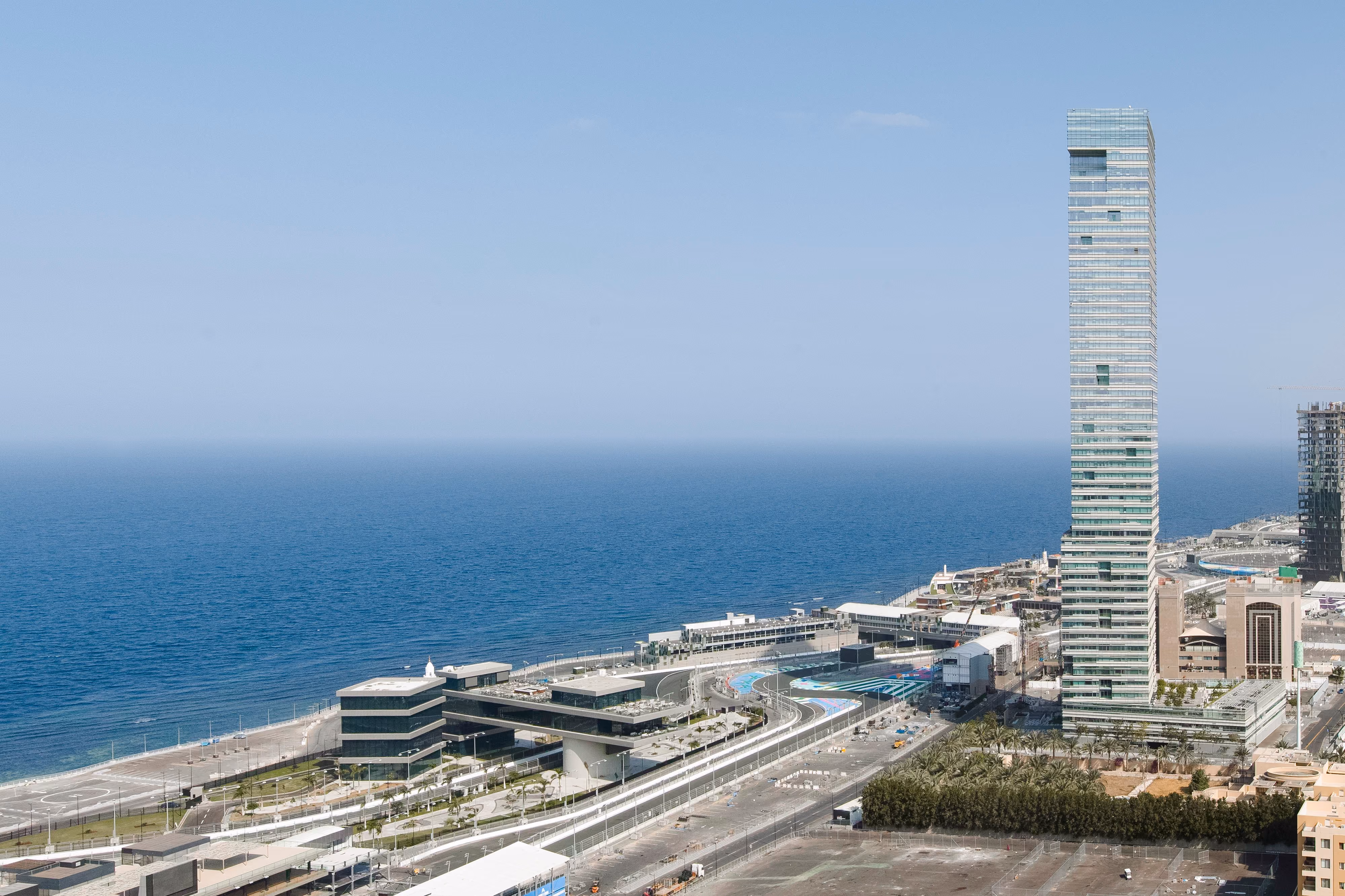 Golden Tower, a slender glass high-rise by Nabil Gholam Architects, standing tall along the seafront corniche in Jeddah, Saudi Arabia
