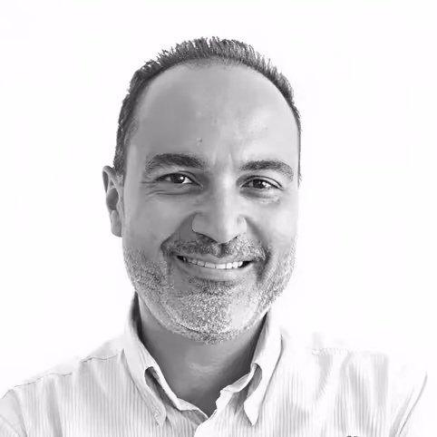 Alem & Associates, legal counsel to Nabil Gholam Architects, black and white portrait of a man with a short grey beard in a striped shirt