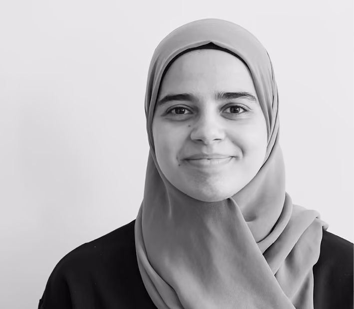 Lina Hammoud, Architect at Nabil Gholam Architects, black and white portrait smiling, wearing a hijab and a dark top