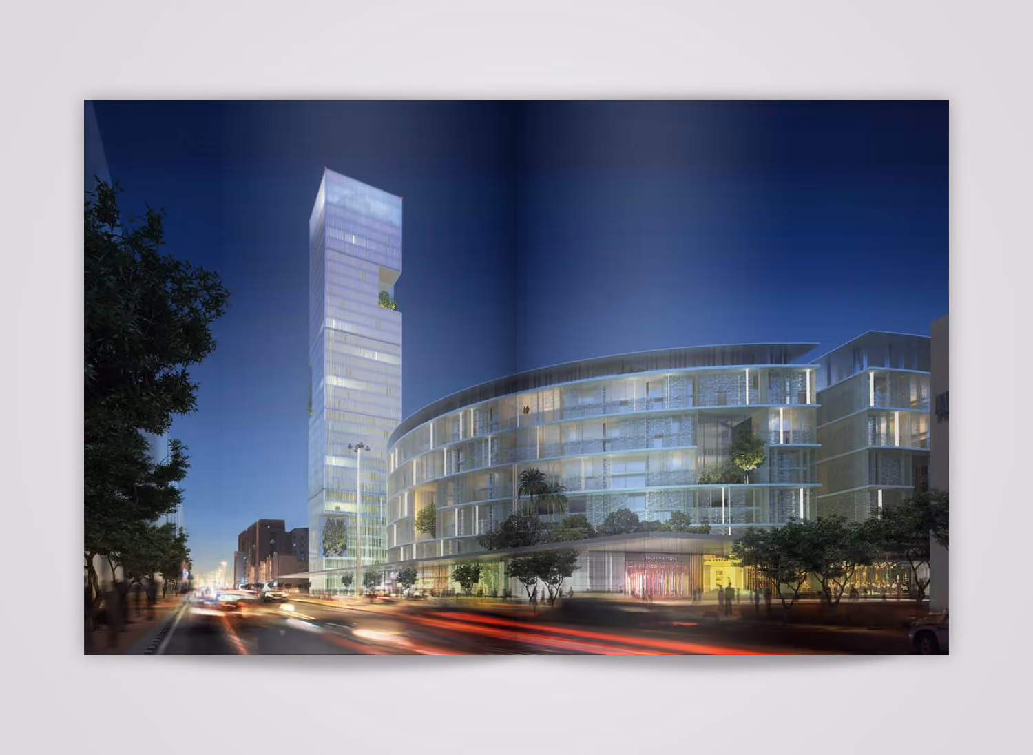 Inside page of the Eastwest monograph, 2014, showing a night-time rendering of a slender glass tower beside a curved perforated-facade podium building along a busy street
