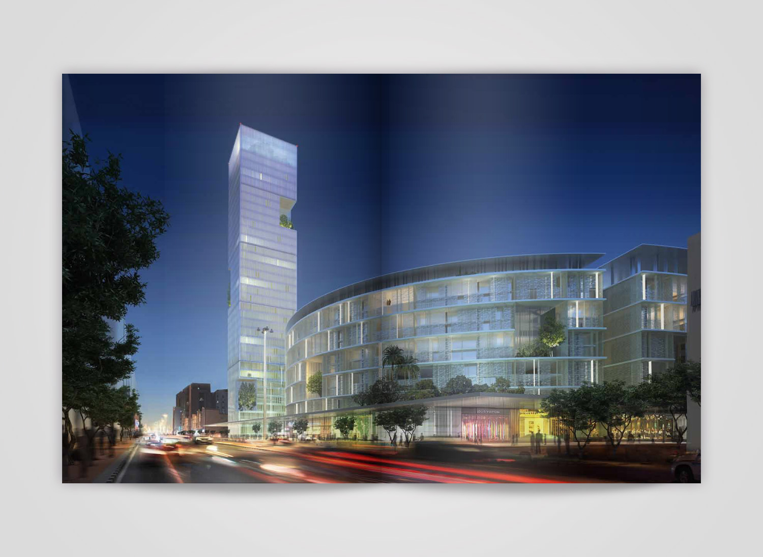 Inside page of the Eastwest monograph, 2014, showing a night-time rendering of a slender glass tower beside a curved perforated-facade podium building along a busy street
