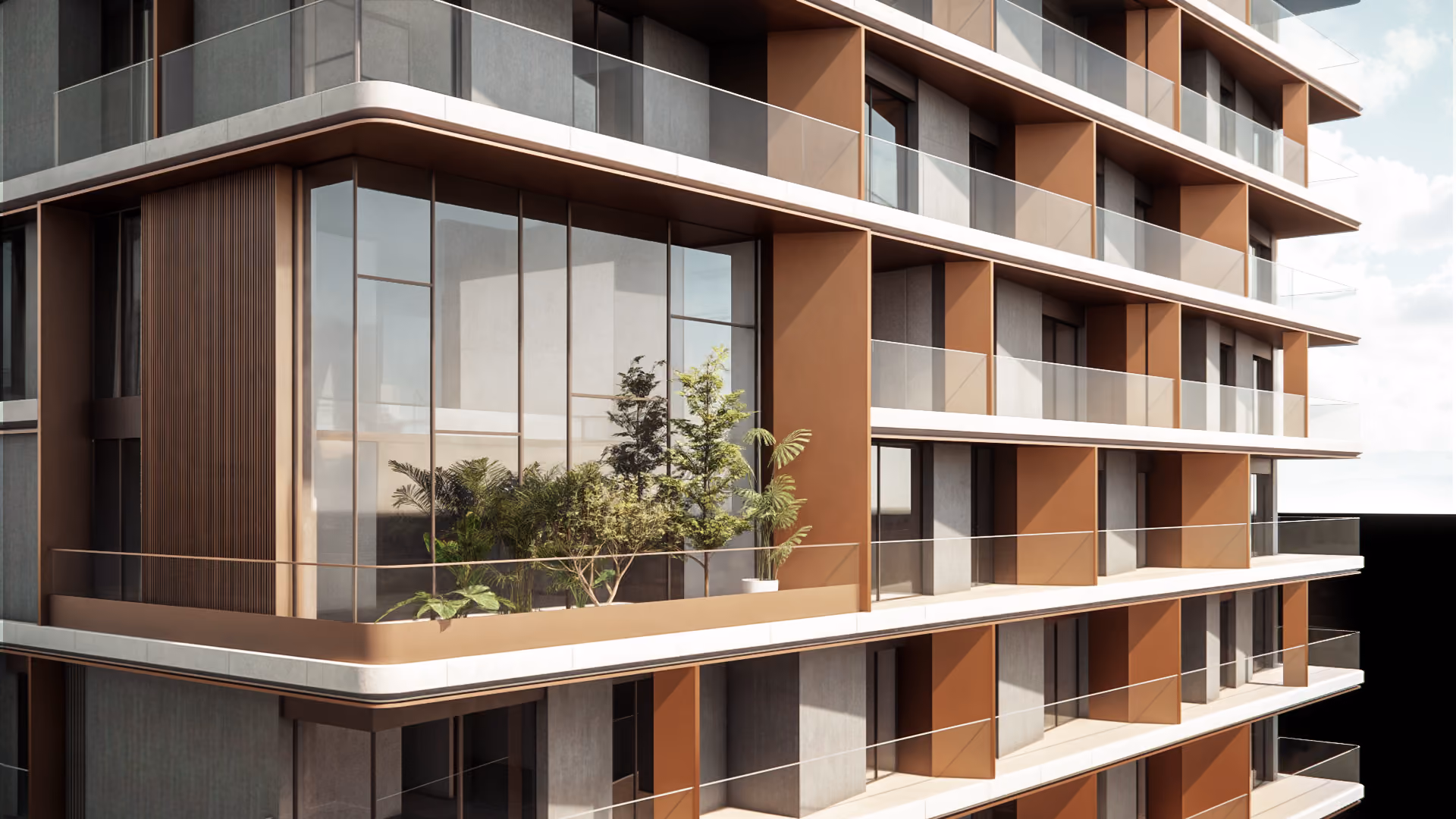 Rounded facade detail with terracotta-toned mullions, glass balconies and a planted terrace, showing the human-centred design approach of Nabil Gholam Architects