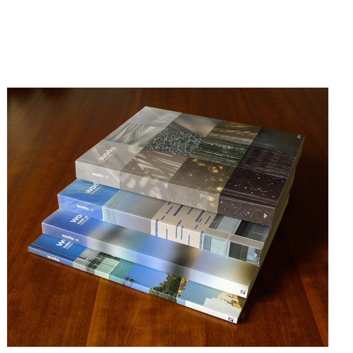 Stacked editions of Works 2017, Nabil Gholam Architects' curated project monograph, with earlier volumes Works 05, 13 and 17 shown as a set