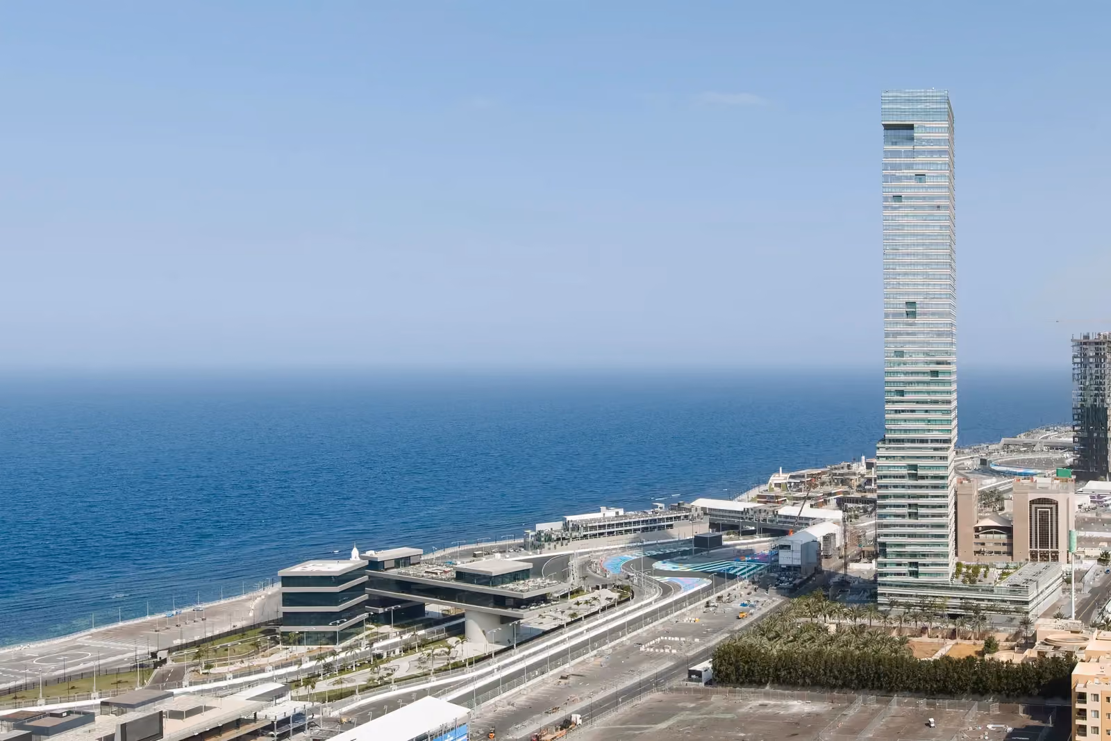 Golden Tower, a slender glass high-rise by Nabil Gholam Architects, standing tall along the seafront corniche in Jeddah, Saudi Arabia