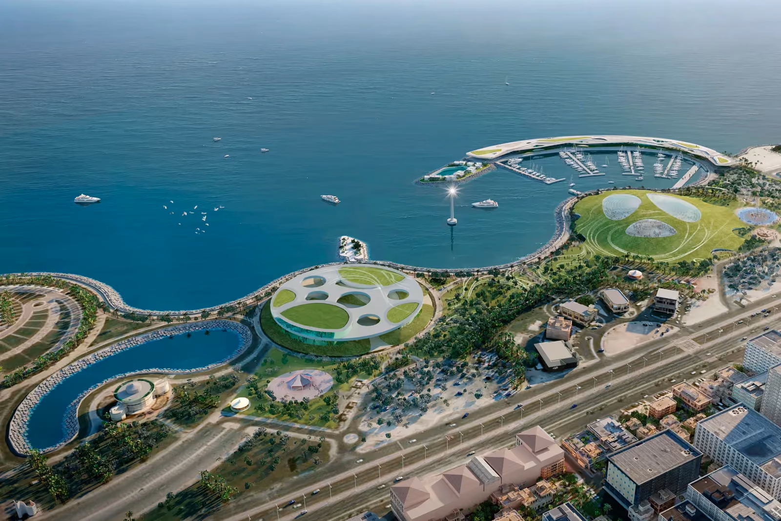 Aerial view of the Seafront Entertainment Center in Al Khobar, Saudi Arabia, by Nabil Gholam Architects, showing a circular perforated pavilion, marina and coastal promenade