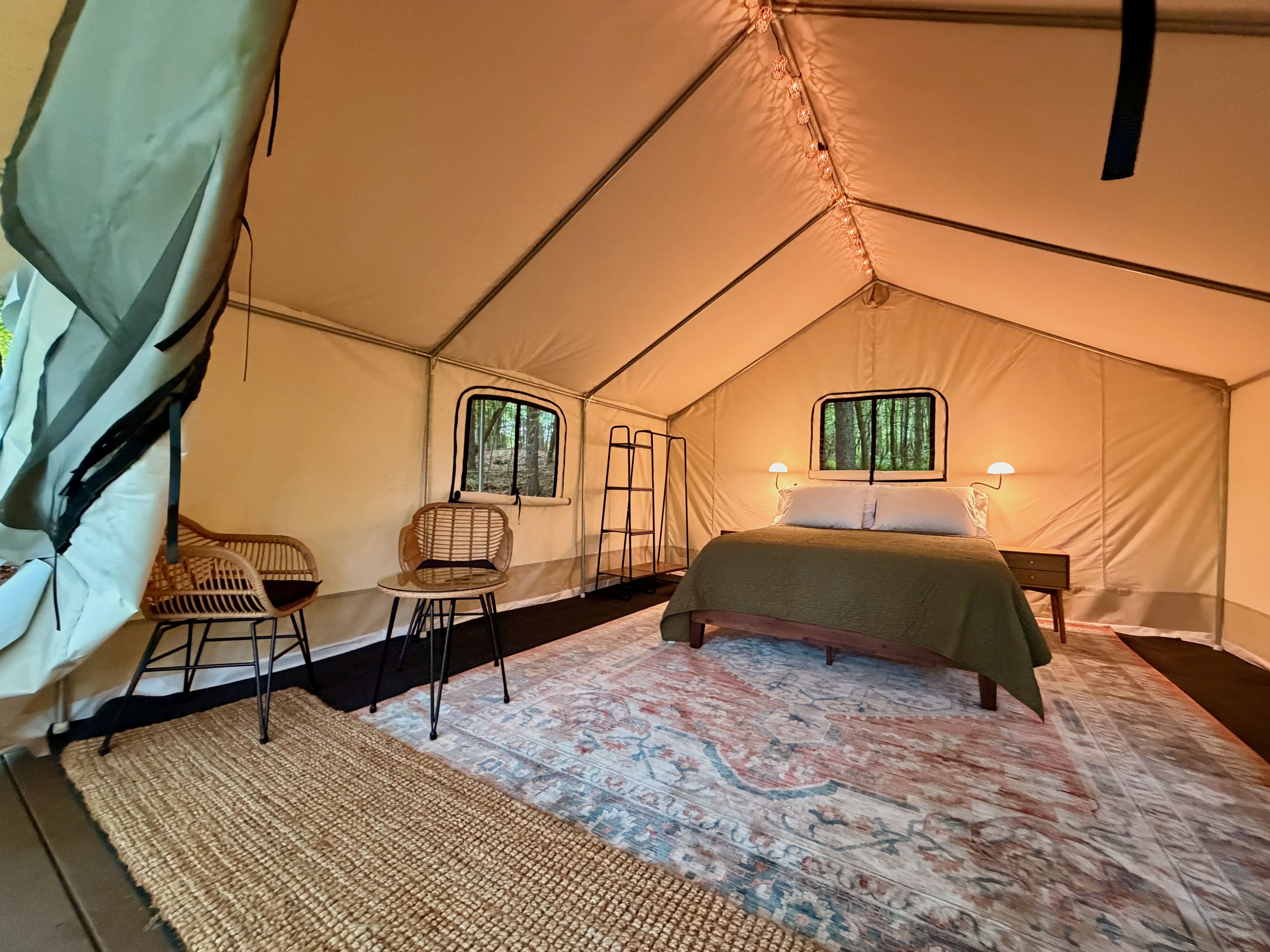 Inside the safari tent, queen bed made up