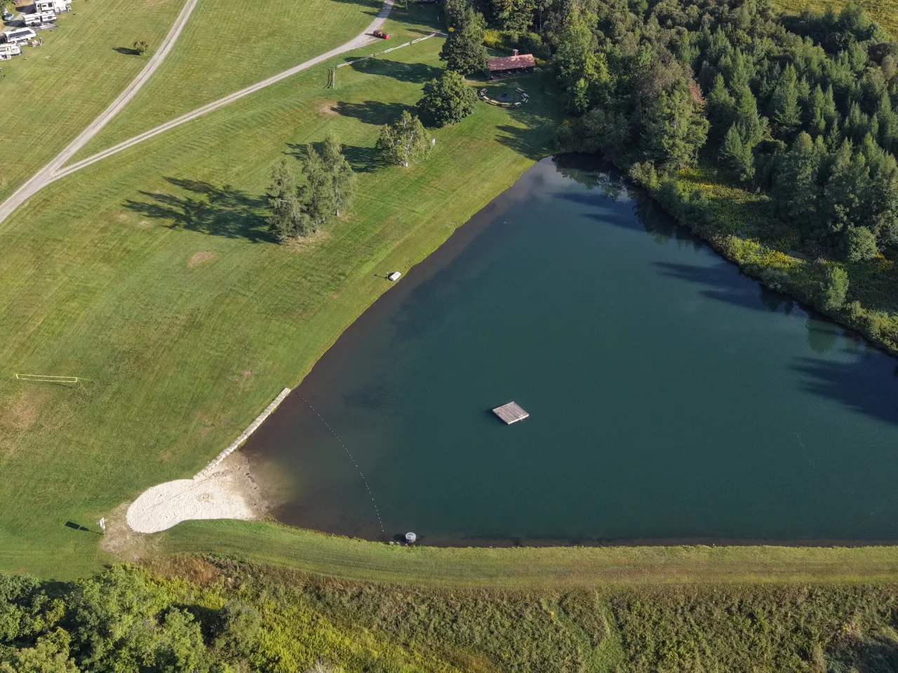 Overhead view of the three-acre swimming lake and beach at Lake Champagne