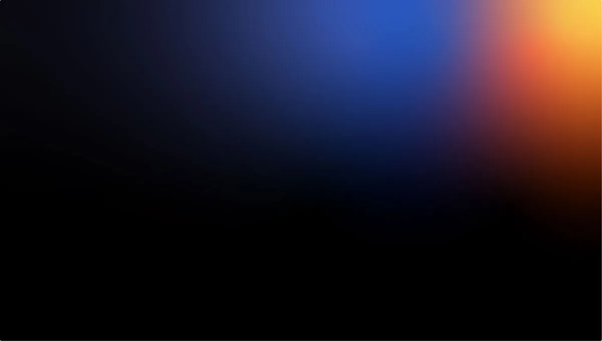 Gradient background blending black, dark blue, orange, and yellow colors smoothly.