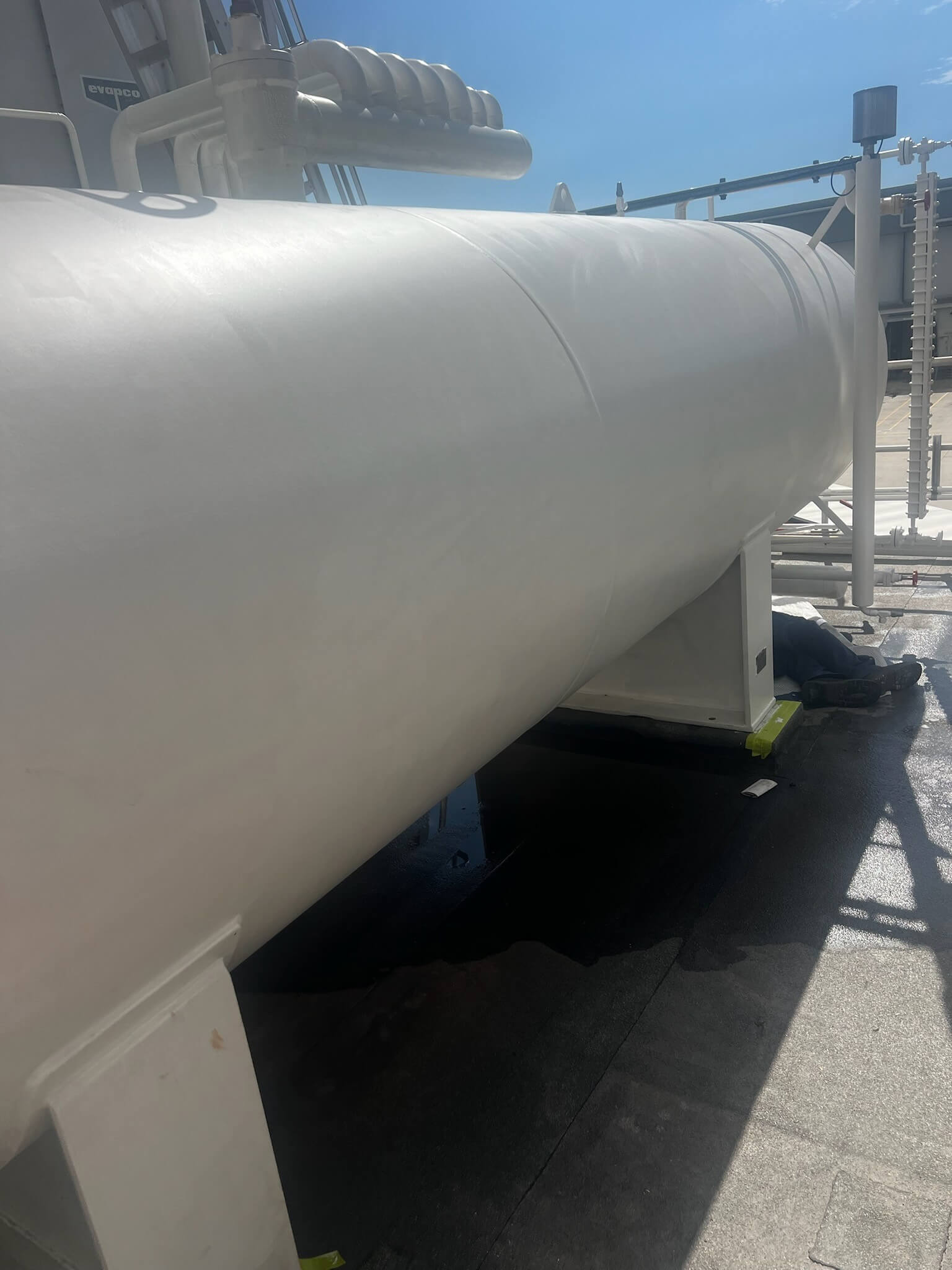 Before shot: maintenance on industrial piping and tank at industrial site