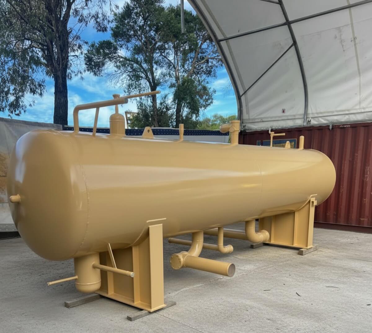 In progress: 1st coat beige industrial pressure vessel