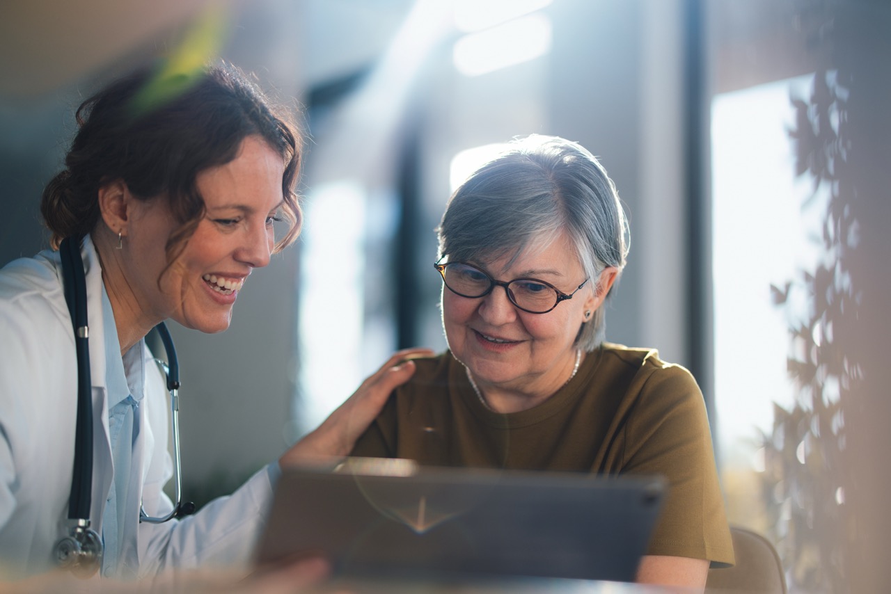 Clinician reviewing care information with an older person