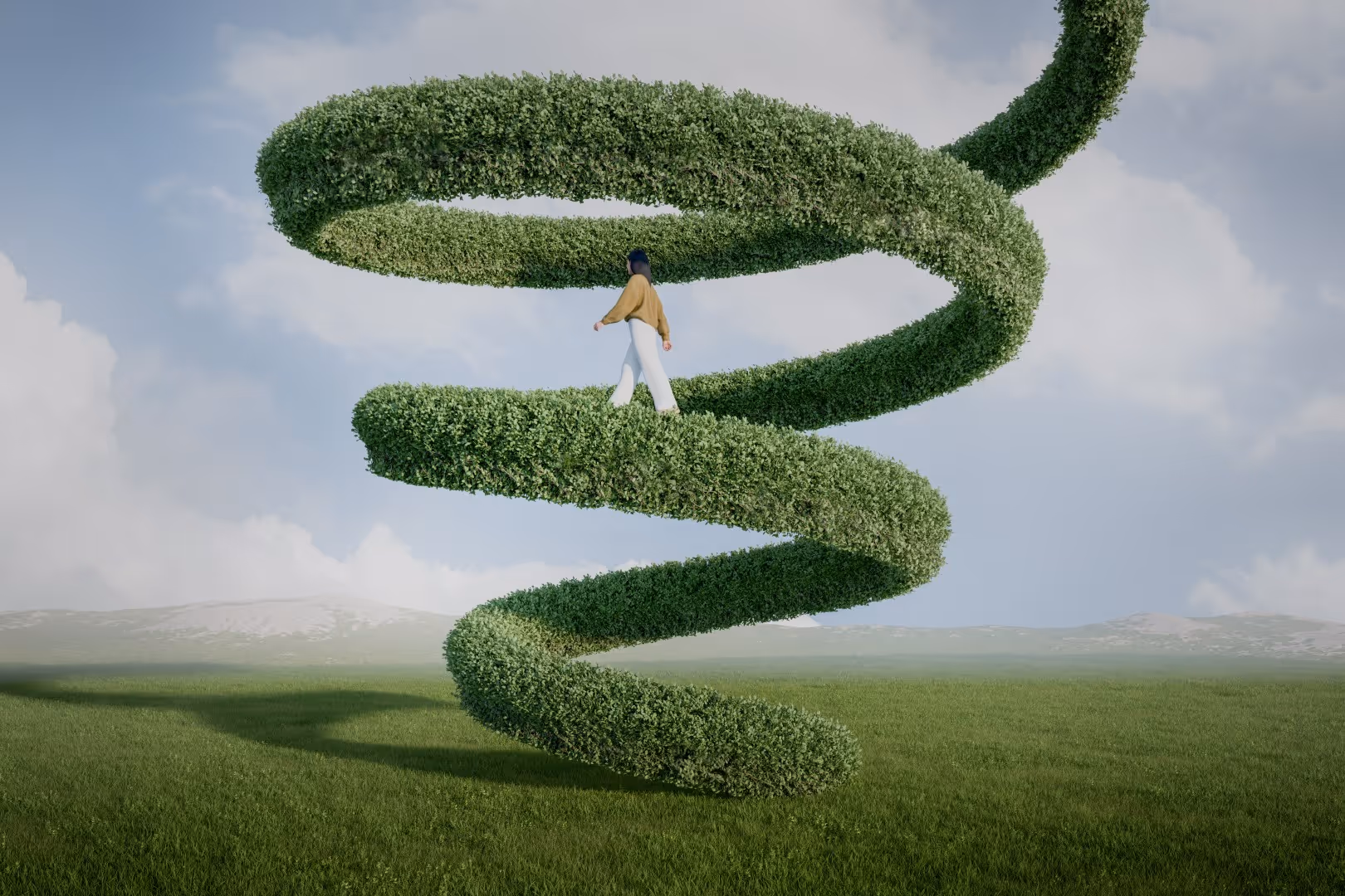 Person walking on a large green spiral hedge suspended above a field under a cloudy sky.