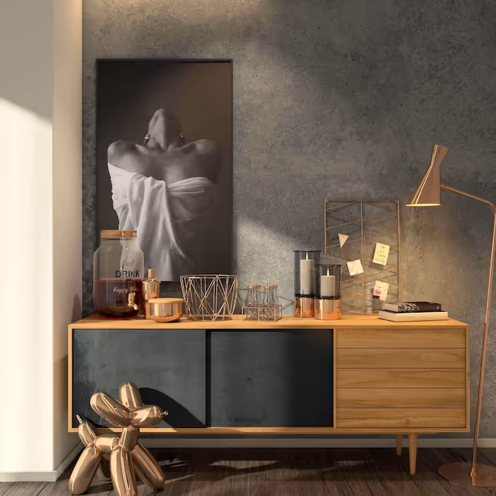 Modern wooden sideboard with black doors, decorative items, and a monochrome portrait on a textured wall.