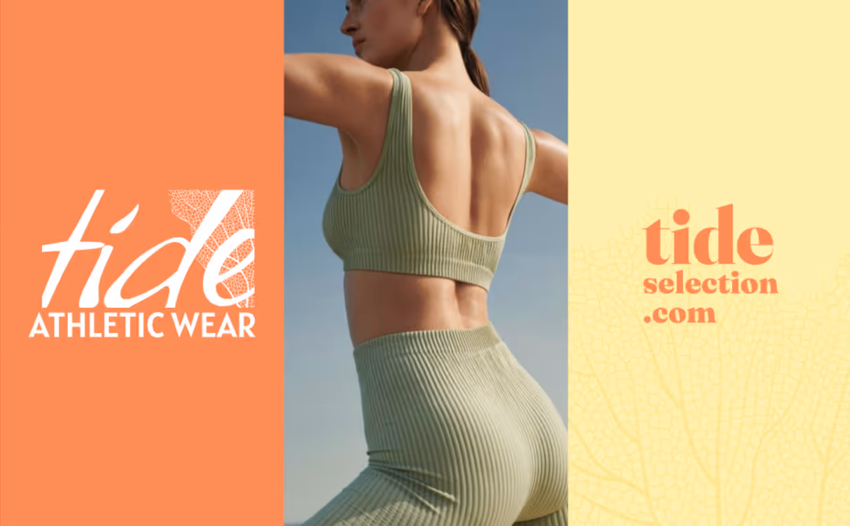 Woman in green ribbed athletic wear poses outdoors against a blue sky with brand text on sides.