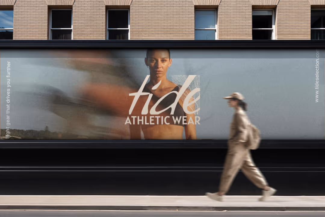 Outdoor billboard shows a woman in athletic wear with 'tide ATHLETIC WEAR' text and blurred runner.
