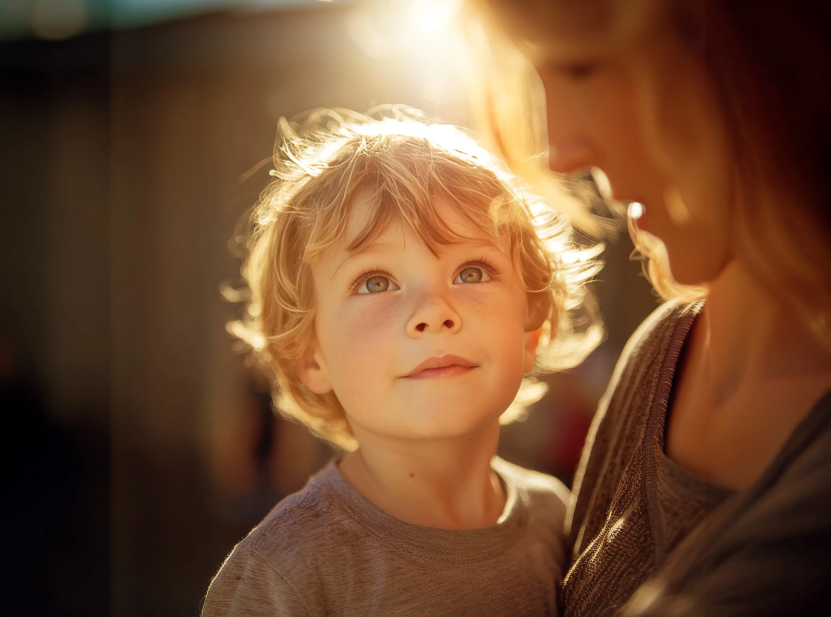 A woman and a child are looking at something.