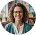 A woman with glasses and a green cardigan.