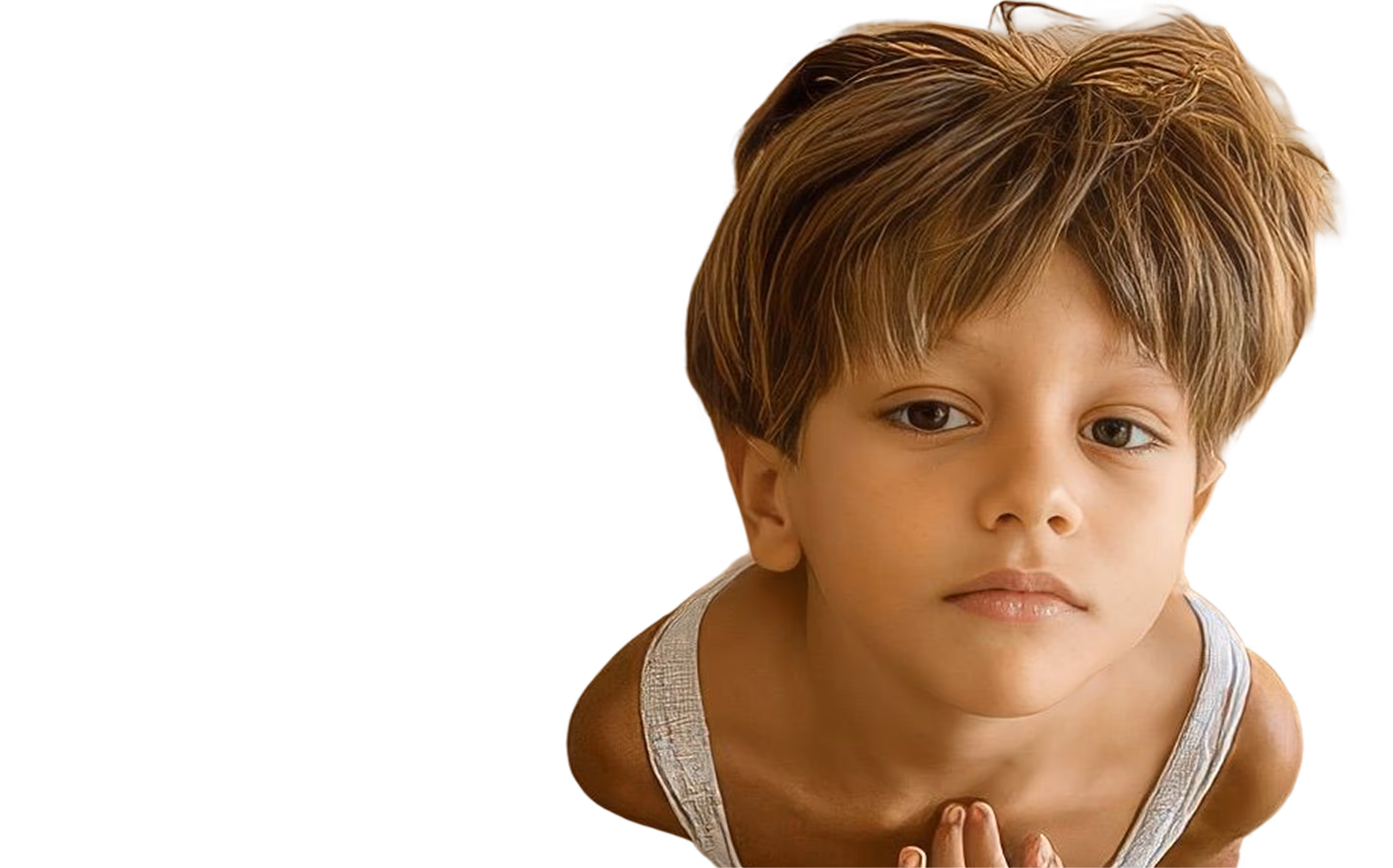 Young boy with tousled light brown hair and white tank top