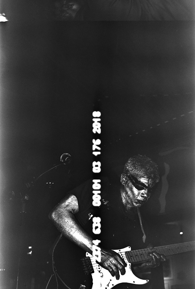 B&W film photo taken of a live performance of Ashvind Ramani (@ilovefudgy) as a part of a performance/documentary based off his single 'Freak'