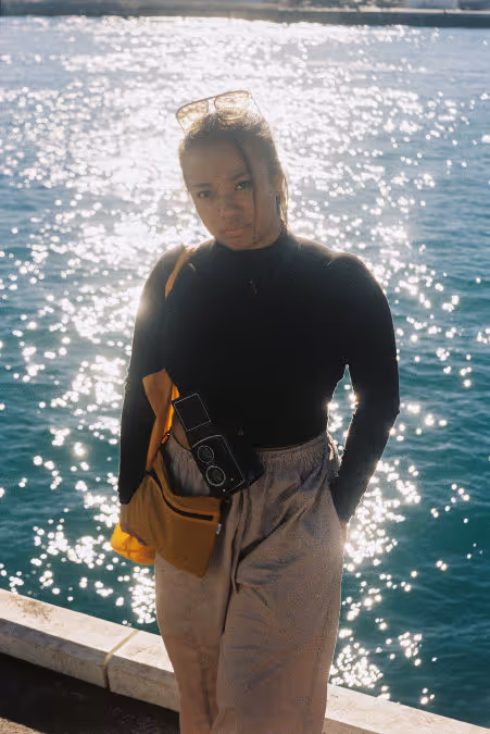 Electus Films founder Ayu. Film photo taken in Fremantle with water in background.