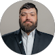 Man in business casual attire with beard, smiling professionally, suitable for MSP team or IT support staff profile