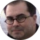 Man wearing glasses looking slightly off-camera, representing professional IT managed services leadership in Germantown TN
