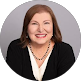 Woman in professional business attire smiling, representing NET-i managed IT services leadership team in Germantown TN