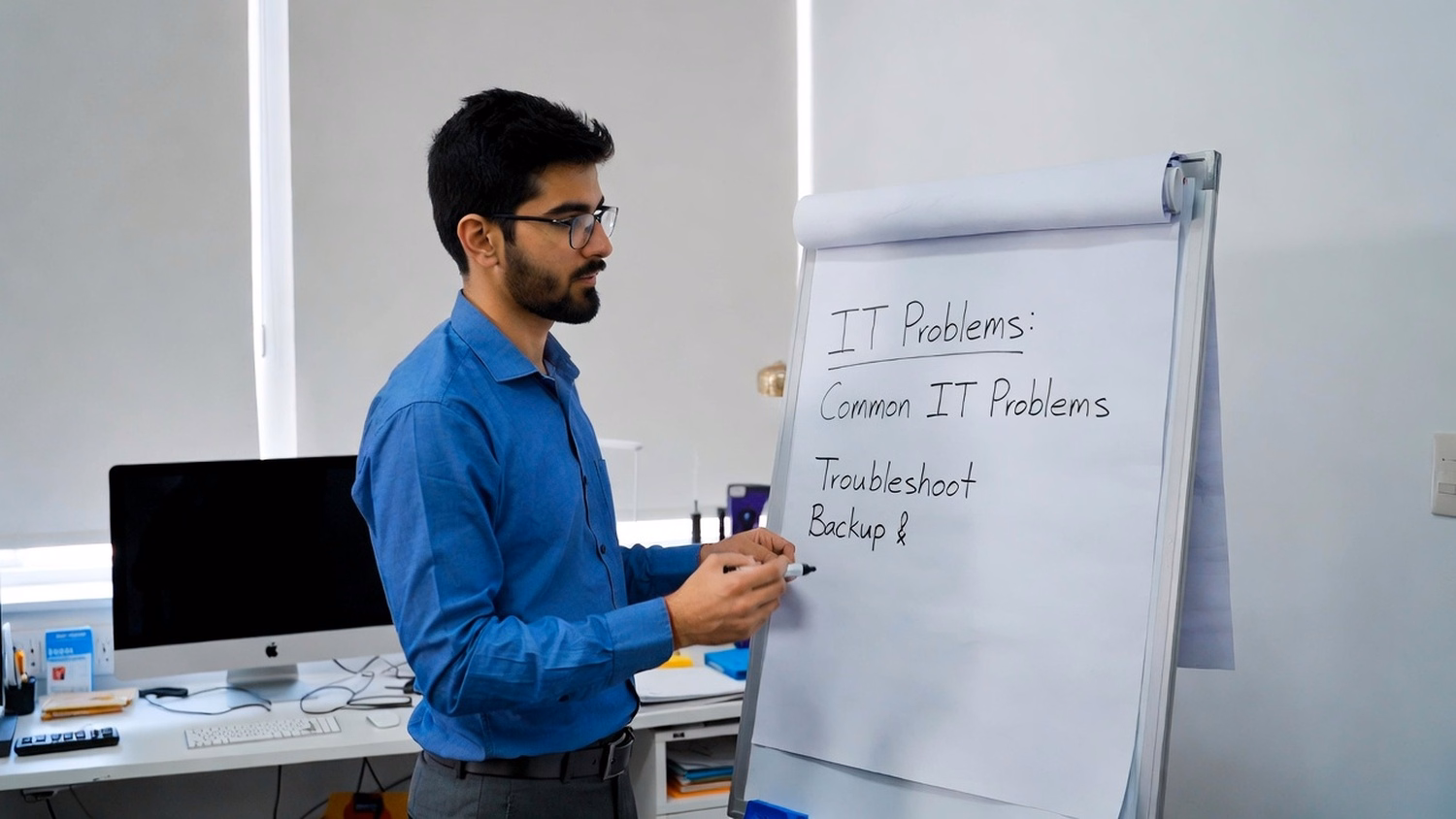 WHITEBOARD SESSION An IT professional one or two people standing at a whiteb