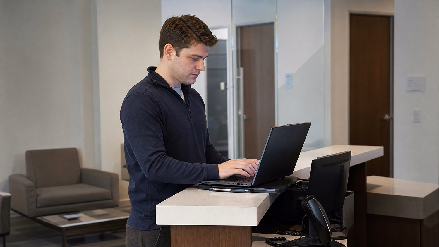 RECEPTION AREA An IT professional one person standing at a front reception d