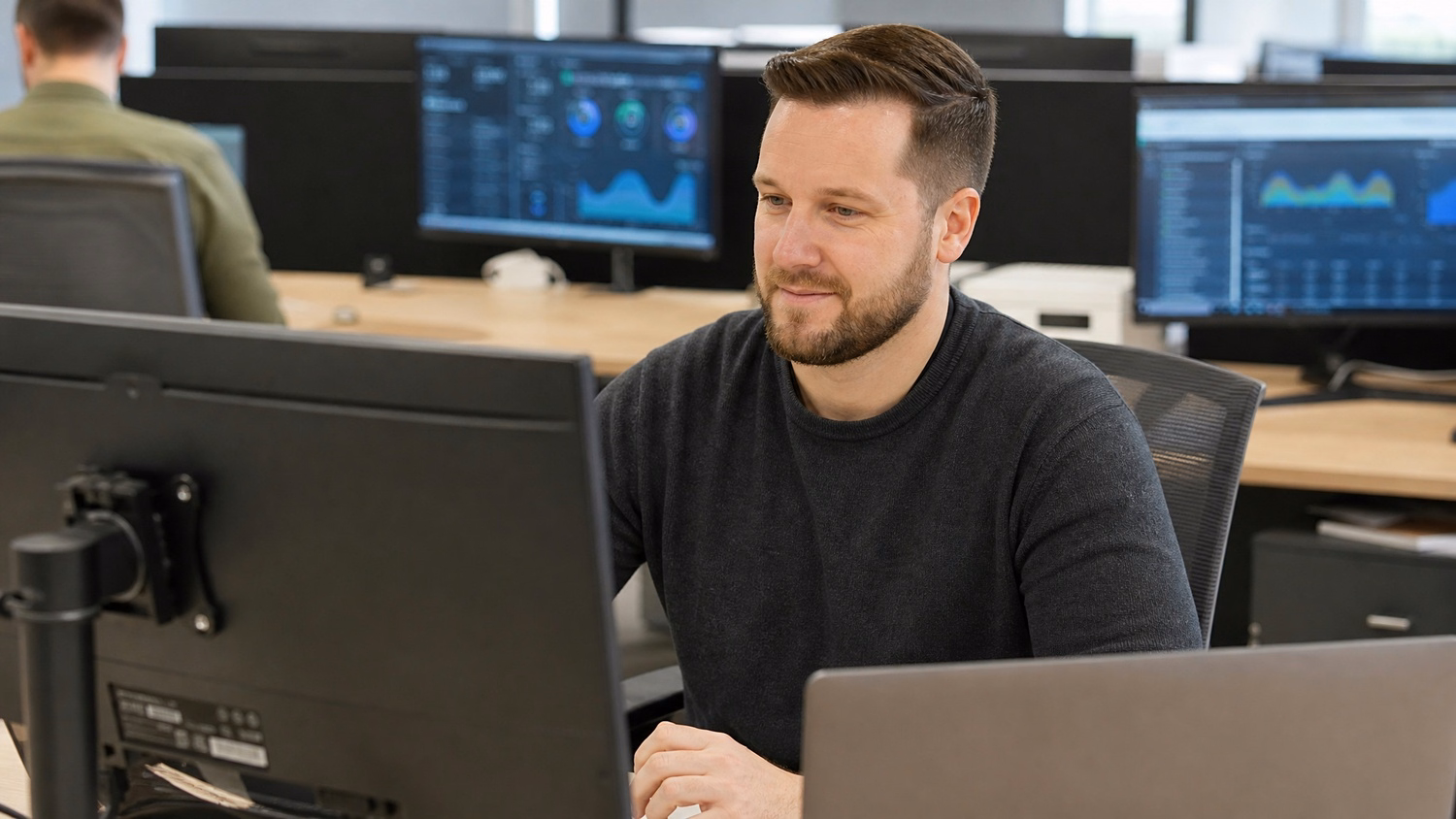 An IT professional focused on a task related to Business IT Solutions for Small